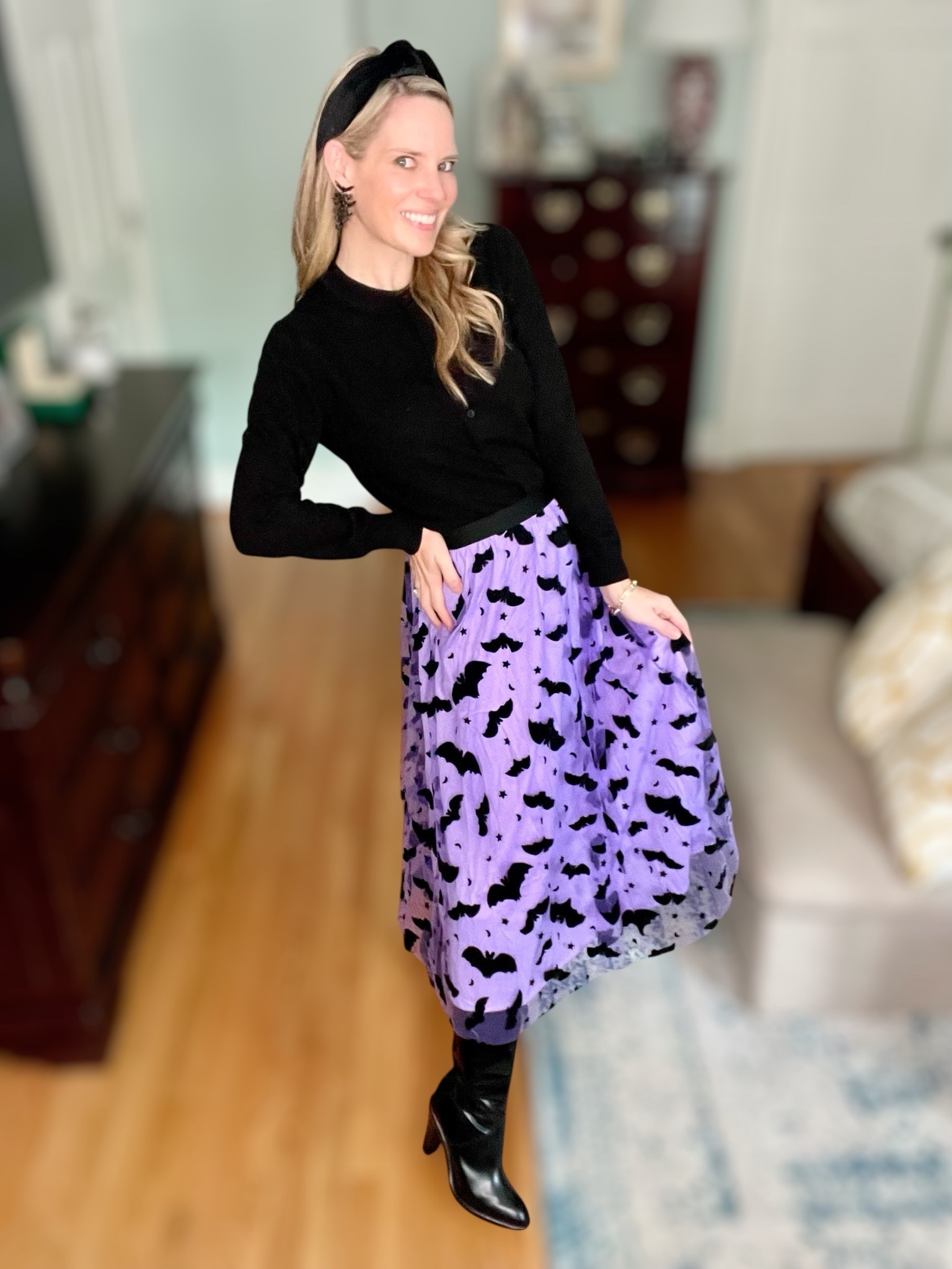 🦇✨ Spooky chic style for Halloween! This purple bat tulle skirt is so fun and festive—perfect for school parties, mom life events, or a not-so-scary Halloween outing. I paired it with a classic black sweater, sleek knee-high boots, a velvet padded headband, and the statement-making BaubleBar bat earrings 🖤. This look is festive yet elevated, and so easy to recreate with affordable Amazon + Walmart finds mixed with standout accessories.

🛍️ Shop the look:
	•	Black cozy yarn crewneck sweater (Walmart Free Assembly)
	•	Purple bat print tulle skirt (Amazon)
	•	Knee-high boots (Amazon + Michael Kors options)
	•	Velvet padded headband (Lele Sadoughi + Walmart options)
	•	BaubleBar bat earrings 🦇

This outfit is the perfect mix of spooky + chic for October style, whether you’re dressing up for Halloween spirit week, hosting friends, or creating fun family memories. 🎃

⸻


Halloween outfit idea 🎃 | spooky chic outfit | bat print skirt | Halloween skirt outfit | purple Halloween skirt | mom-friendly Halloween outfit | elevated Halloween look | chic spooky season style | BaubleBar bat earrings | Halloween statement jewelry | velvet padded headband | Lele Sadoughi look for less | affordable Amazon Halloween finds | festive October outfits | Walmart fall fashion | chic Halloween party look | cute teacher Halloween outfit | mom style Halloween fashion | spooky yet classy outfit


#LTKFindsUnder100 #LTKOver40 #LTKFindsUnder50