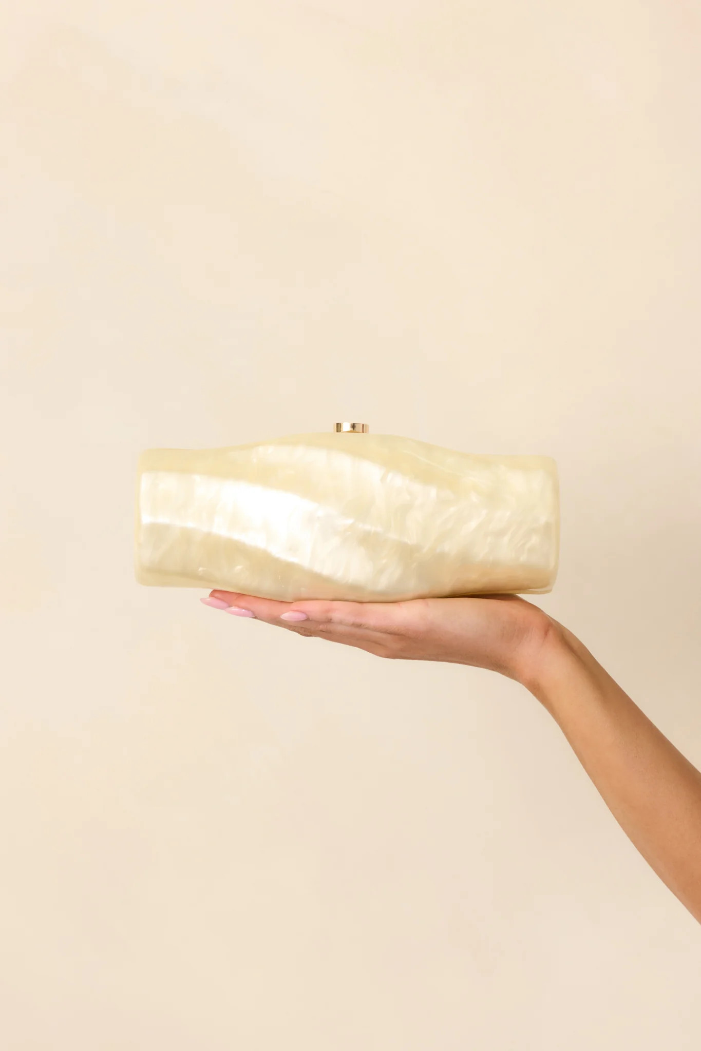 Got My Spark Back Champagne Pearlescent Spiral Clutch | Red Dress