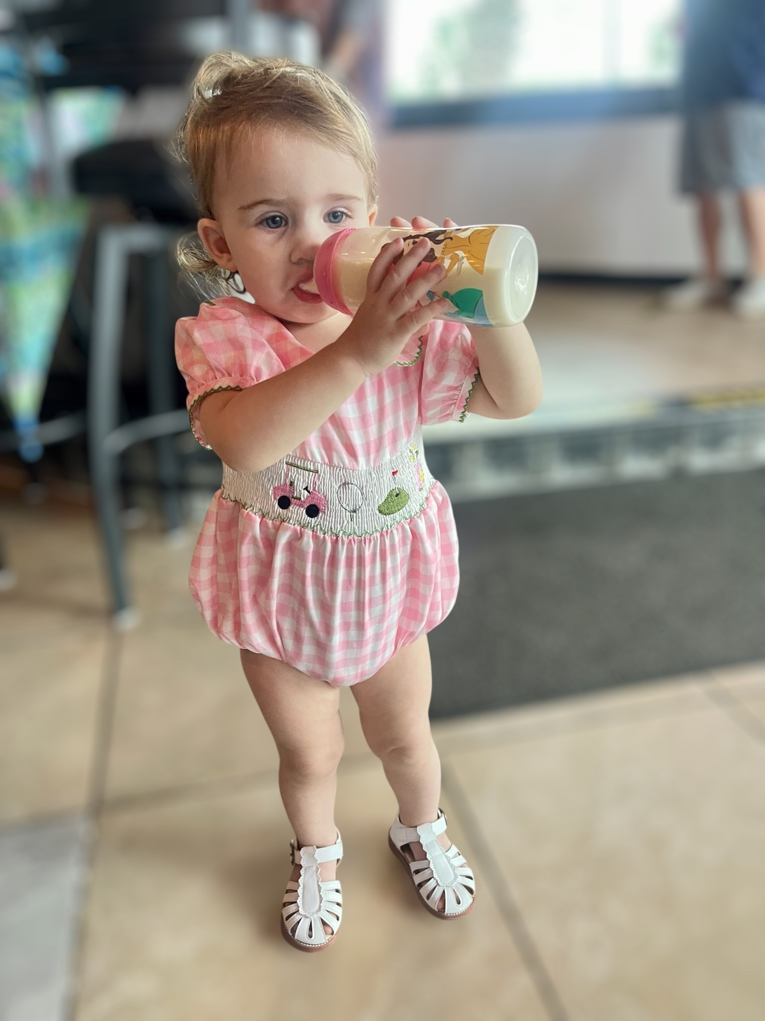 🎀⛳ How darling is this pink gingham bubble romper for your little golfer?! Featuring the sweetest smocked panel with golf cart, ball, green, and bag embroidery, plus a scalloped Peter Pan collar and puff sleeves trimmed in green 🩷 Perfect for summer outings, family photos, or a day at the country club! Paired here with classic white T-strap sandals for the ultimate preppy toddler look 👧✨

#LTKKids #LTKFindsUnder50 #LTKBaby
