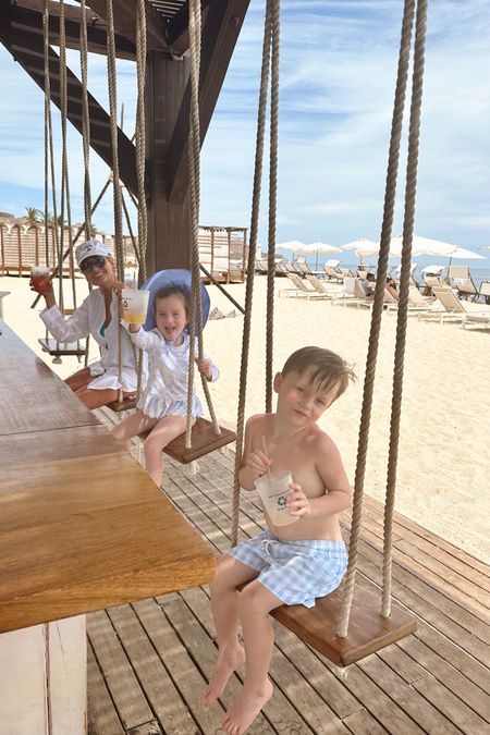 Twins and Nana chilling on beach swings with their drinks!  #BeachLife #FamilyTime #RelaxationMode

#LTKswim #LTKkids #LTKfamily