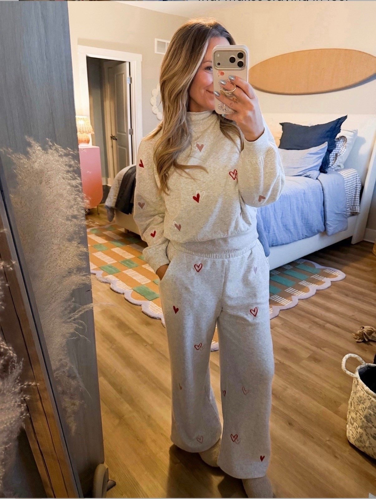 This is the kind of outfit that makes staying in feel special. Soft, comfy, and just the right amount of cute with the subtle heart details. Perfect for lounging, slow mornings, or a cozy night at home when you still want to feel put together. Linking the full set here.

matching sweat set, cozy lounge outfit, heart print sweat set, comfy loungewear, casual mom outfit, stay at home outfit, soft sweats