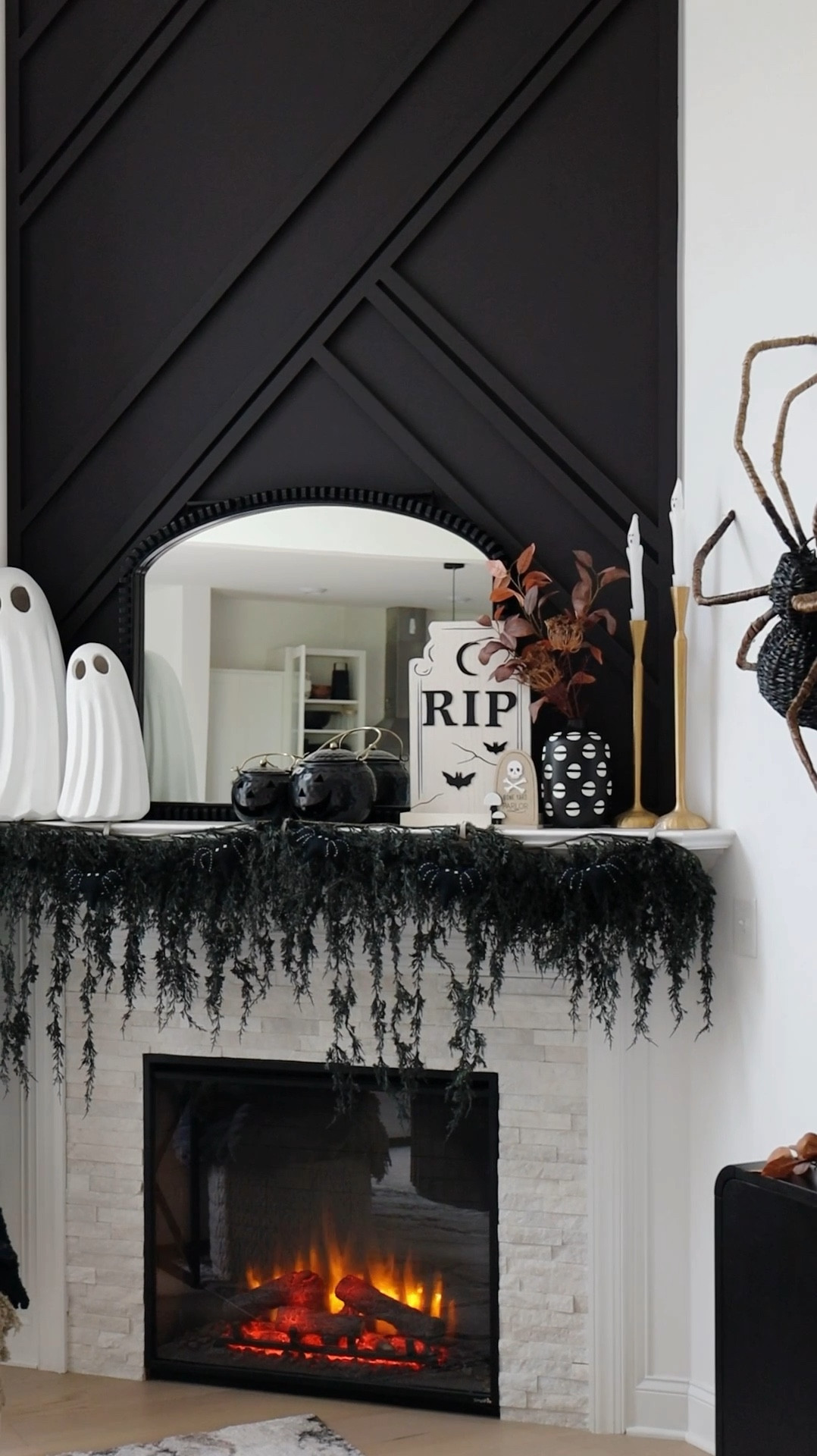 Living Room Falloween Decor👻 🍂
The black garland is from Anthropologie but it is sold out currently and not allowing me to tag. Try this link:

https://www.anthropologie.com/anthroliving/shop/led-cascading-black-boughs-garland.  

Big pillows are from Target last year,
Gold Candle Sticks are from Kirkland,
B&W vase from HomeGoods, 
Spiders are from HomeGoods
Black and Gold pumpkins are from HomeGoods, blankets are from Marshall’s, Ghost candlesticks are from HomeGoods, Bat Garland is from HomeGoods.

#LTKFallSale #LTKSeasonal #LTKHome