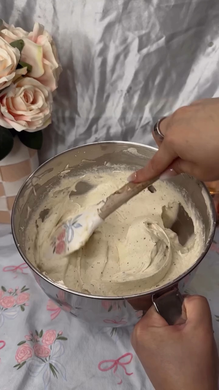 I promise my butter isn’t burnt, its the filter on the video and my pan being scratched up. You really have to love brown butter to enjoy this recipe, especially since it is so brown butter heavy.
.
Recipe card at the end for you to screenshot!
.
Ingredients:
*  4 cups (8 sticks) of unsalted butter
*  2 (15oz) cans of sweetened condensed milk
*  1 ½ teaspoon of salt
*  2 teaspoons of vanilla extract
Instructions:
1.  Brown 3 cups (6 sticks) of the unsalted butter in a medium-sized saucepan until it reaches a maple syrup color. It should take about 8-10 minutes.
2.  Set aside in a heat-safe container on the kitchen counter to cool a little bit for about 30-45 minutes.
3.  Place the now semi-cooled butter in the refrigerator until it reaches a softened butter consistency, about 2 hours. You want the melted butter to solidify a bit before turning it into buttercream, so that air can be whipped into it.
4.  In a stand mixer, mix the softened butter on medium speed for 10 minutes, scraping the bowl occasionally.
5.  Empty the cans of sweetened condensed milk into the mixer and mix until well incorporated.
6.  Finally, add in the vanilla extract and salt, and give the buttercream one last good mix.
7.  Use to decorate your cakes. Do not dye the buttercream because brown butter does not hold color well.
.
#russianbuttercream #brownbutterbuttercream #frostingrecipe #bakingrecipe #brownbutter