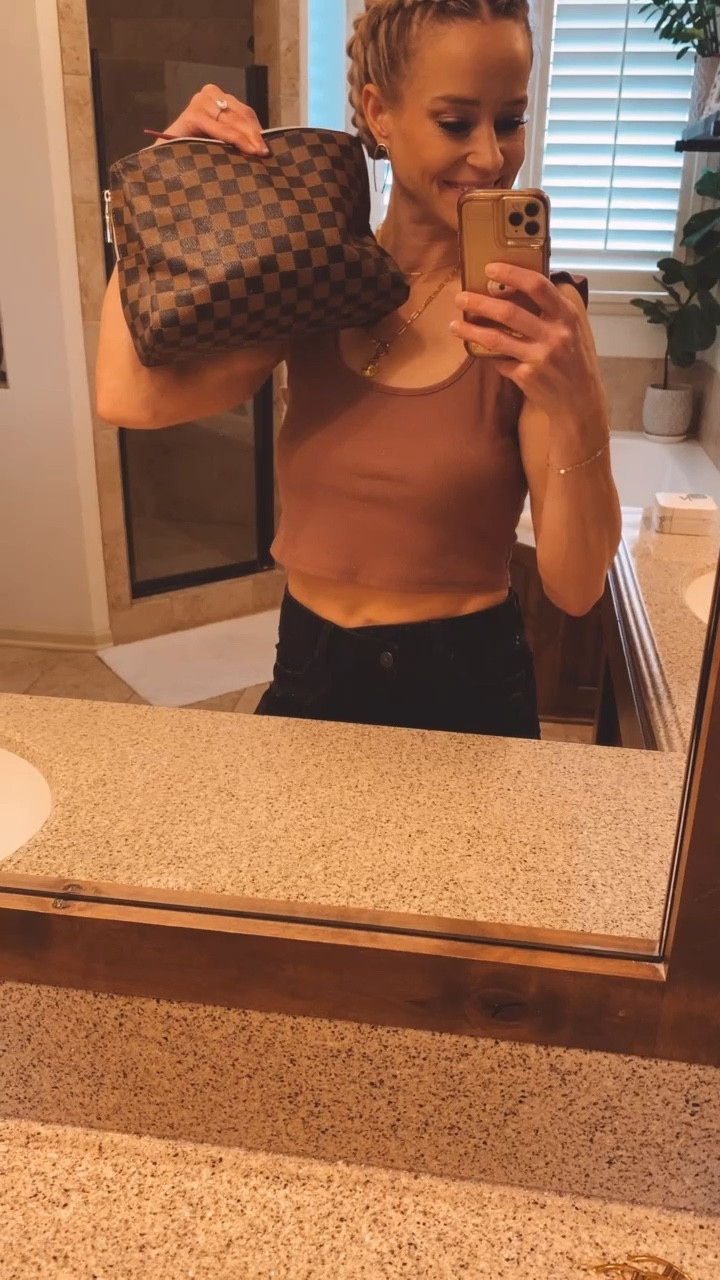 Cutest LV dupe makeup bag. This puppy holds a TON of stuff! 
This would make a fun gift, (bridesmaids, sisters, birthdays, Mother’s Day).
Available in brown and in white. 
🤎🤍
#dupe #makeupbag #louisvuitton #bag #accessories 

#LTKbeauty #LTKunder50 #LTKitbag