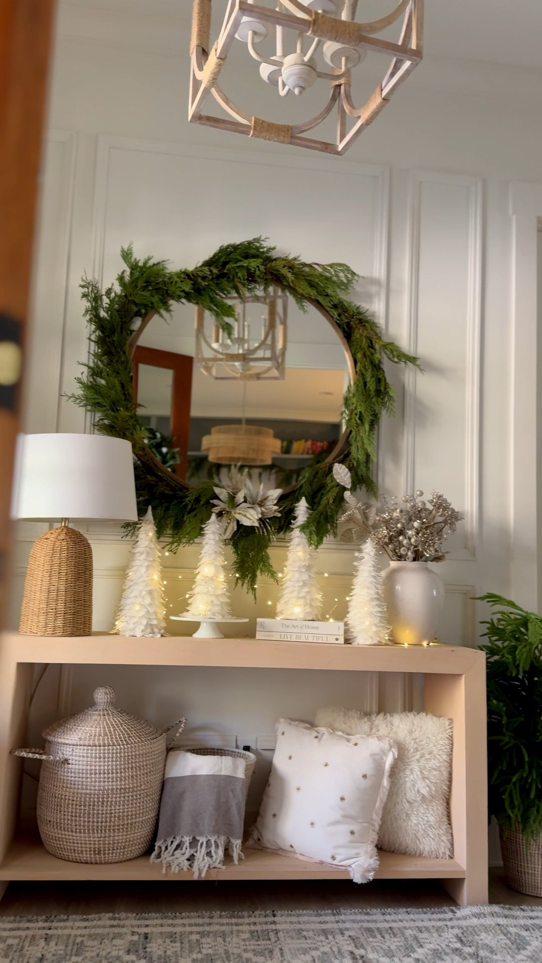 Decorating the entryway for Christmas with this fresh garland and white feather trees and twinkle lights! 

#LTKHoliday #LTKvlog #LTKHome