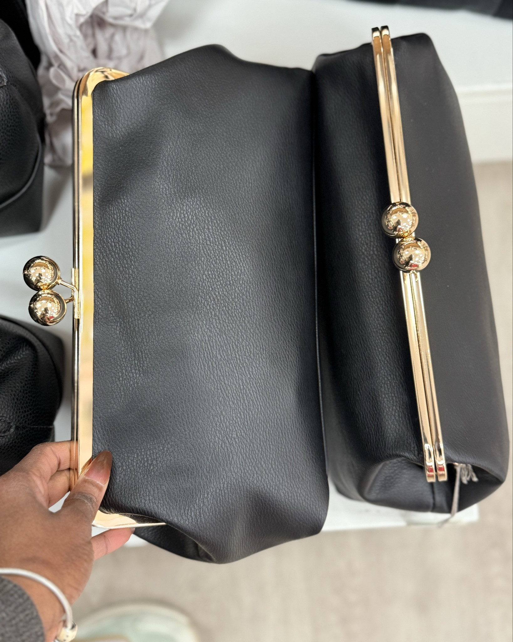 Big black clutch purse. 

#LTKFindsUnder100 #LTKootd #LTKFindsUnder50