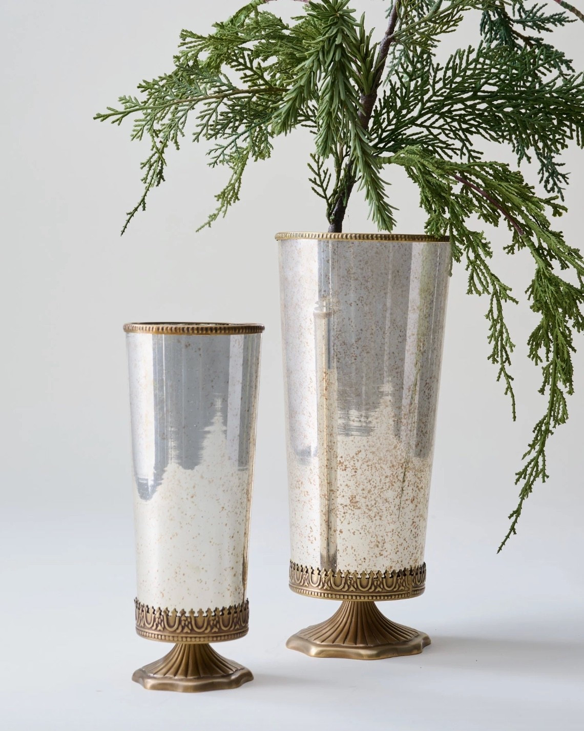 Scalloped brass and mercury glass vessel -  Beautiful filled with seasonal florals, tucked with pinecones or feathers for fall, or mini trees for Christmas. Available in two sizes.

#LTKHome