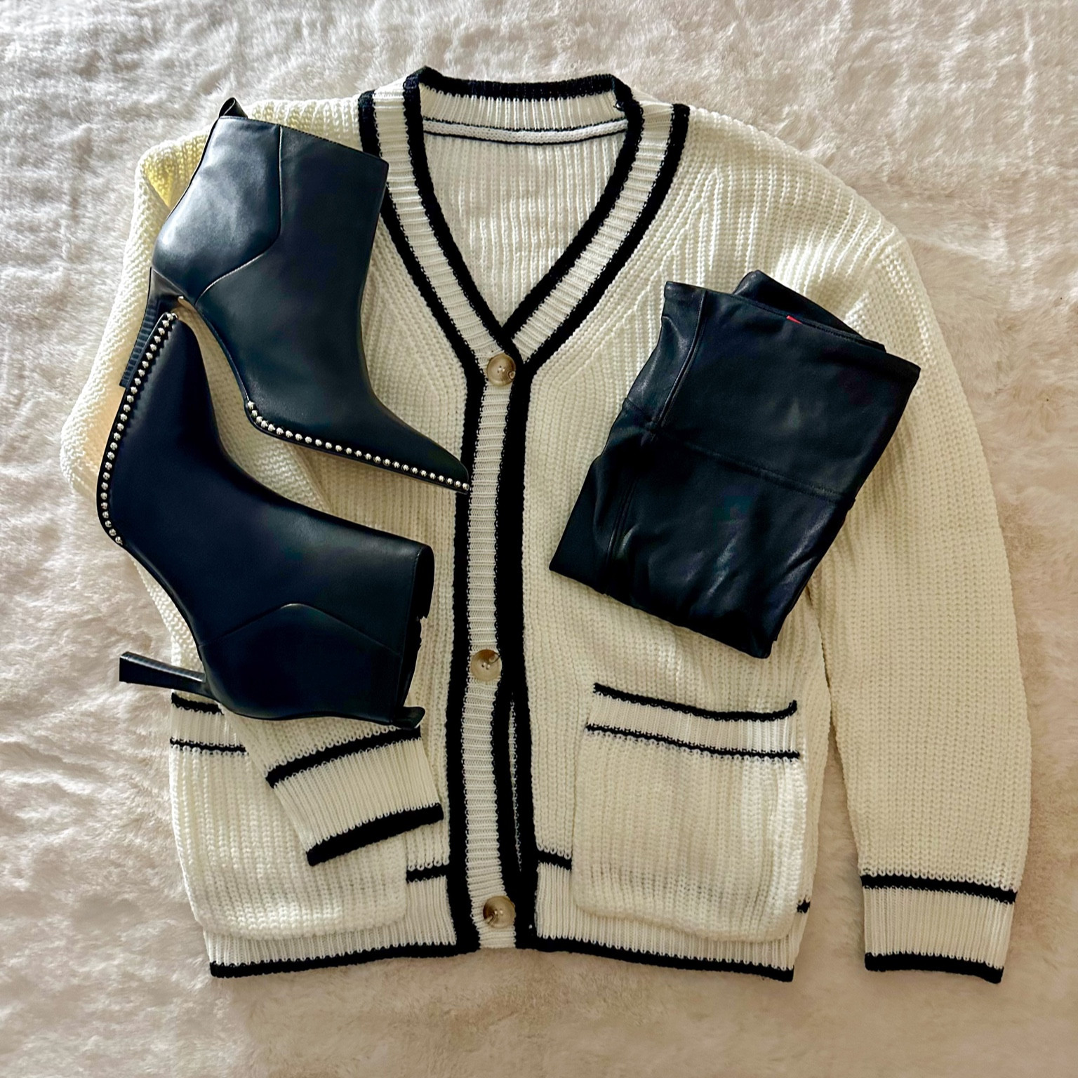 I’m always a fan of black and white outfits. Love this button up sweater paired with black leggings & boots. 🤍🖤

Follow @jenniferxherron for more inspiration ✨

#LTKfindsunder50 #LTKshoecrush #LTKfindsunder100