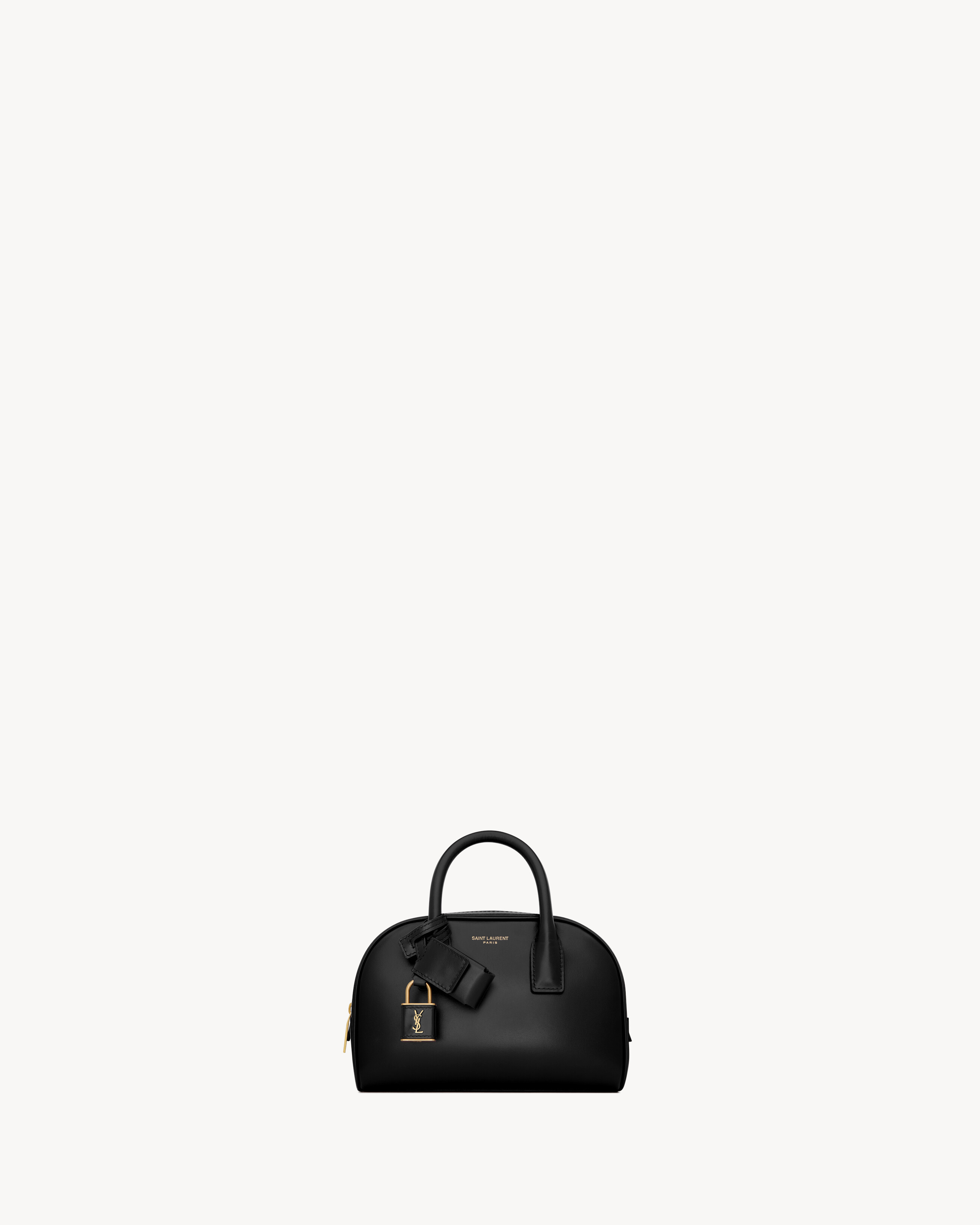 The mini boston bag version of the iconic SAC DE JOUR. This elegant, supple bag features top hand... | Saint Laurent Inc. (Global)