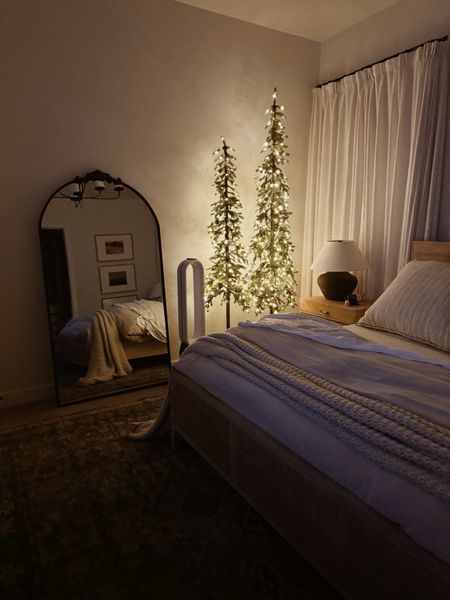 Obsessed with our new alpine trees for our bedroom! I really wanted a tree in our room, but our room is so small. These slim Christmas trees work perfectly! They are on the spendy side, but the tall one is 8’ and smaller is 7’. I couldn’t find anything else in this size. They also have 8 light modes!

#LTKHoliday #LTKhome #LTKstyletip