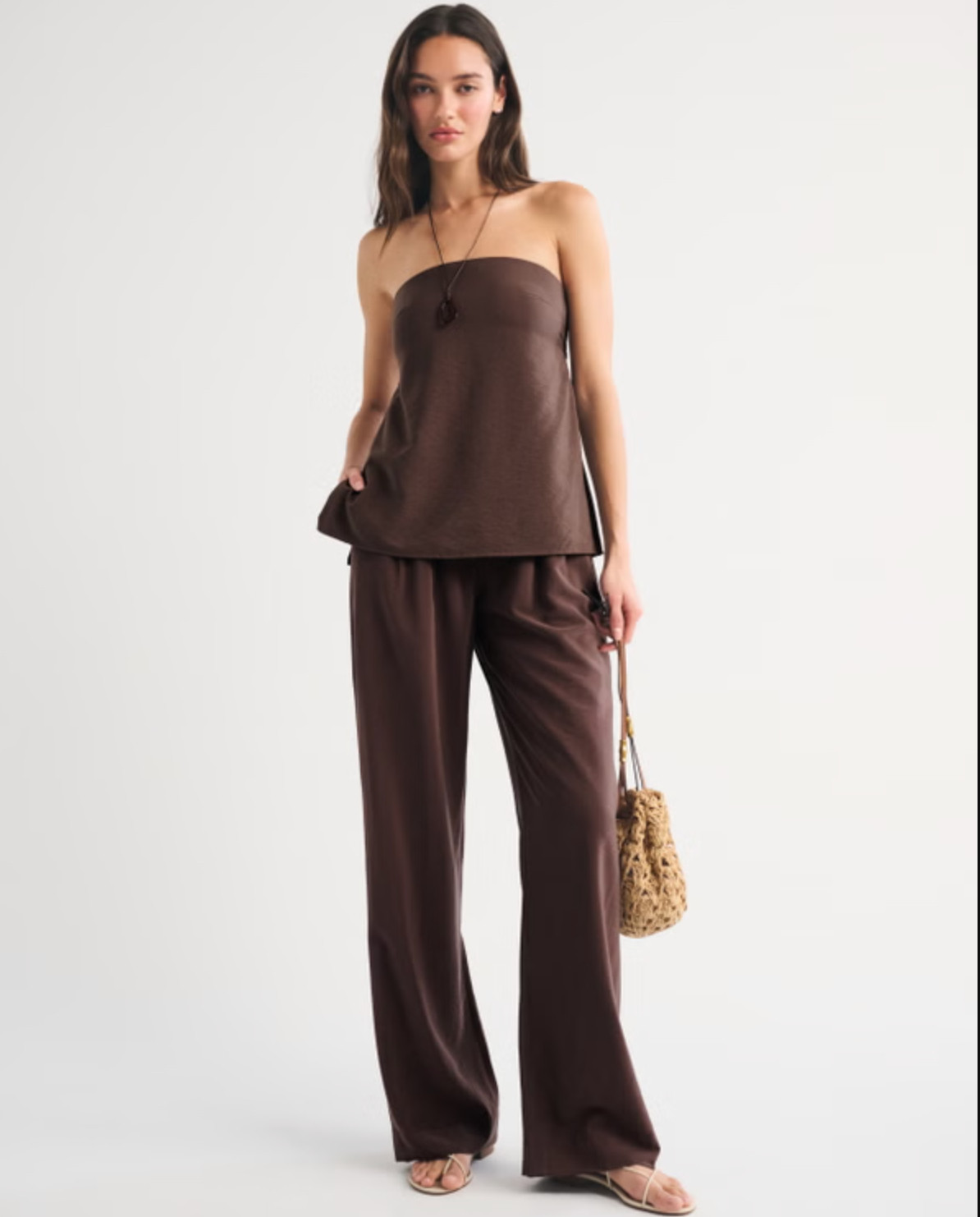 Effortless and a little elevated 🤍 The Abercrombie Strapless Open-Back Set Top is such a chic warm-weather piece. I love the textured crepe fabric, longer length, and the open-back tie detail — it’s equal parts easy and statement-making. Perfect styled with the matching set or your favorite bottoms for a put-together look ✨ 

 #LTKFestival #LTKgrwm #LTKootd