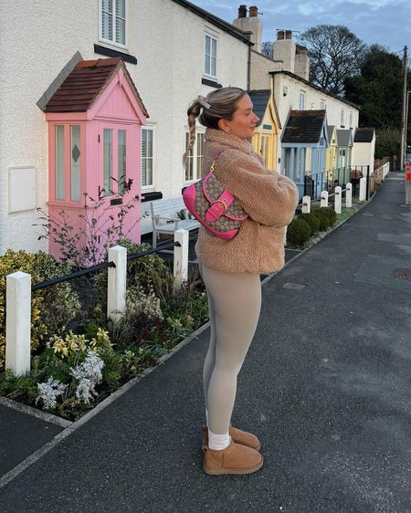 cozy winter outfit with a tan teddy short pile coat, a pink coach soho shoulder bag, nude seamless second skin leggings and ugg ultra mini boots

#LTKeurope #LTKSeasonal #LTKstyletip
