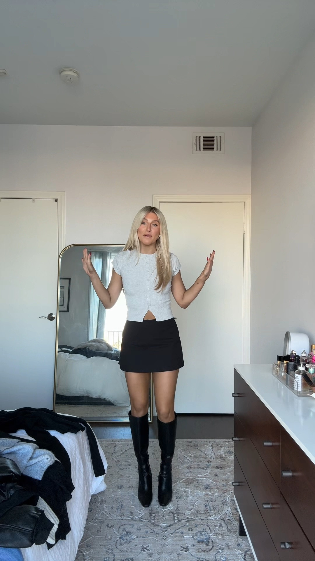 Obsessed with this skort, top and boots combo🖤 

#LTKstyletip #LTKVideo #LTKfindsunder100