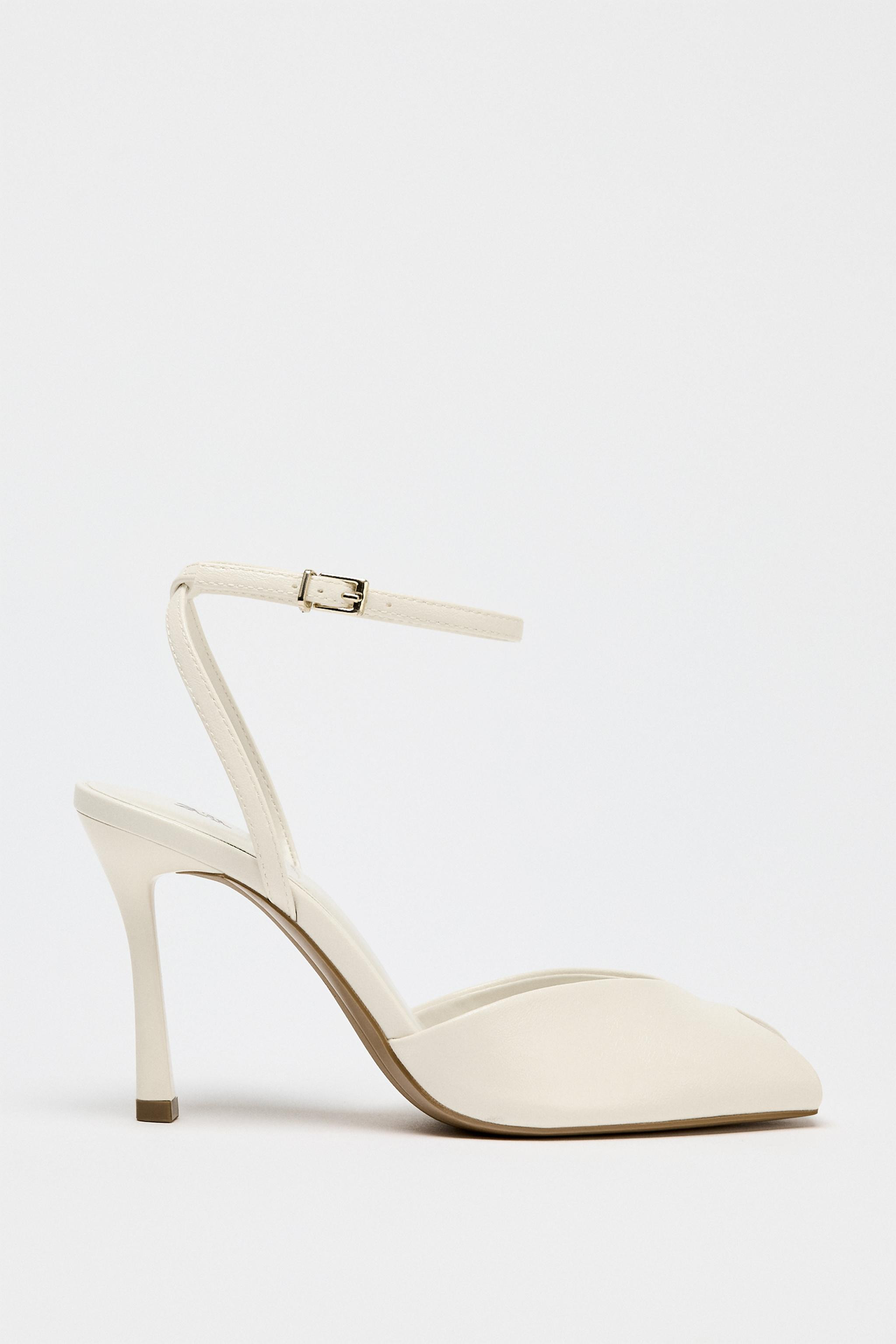 Heeled shoes with opening detail on the upper. Thin high heel. Buckle strap closure. Square toe.H... | Zara US