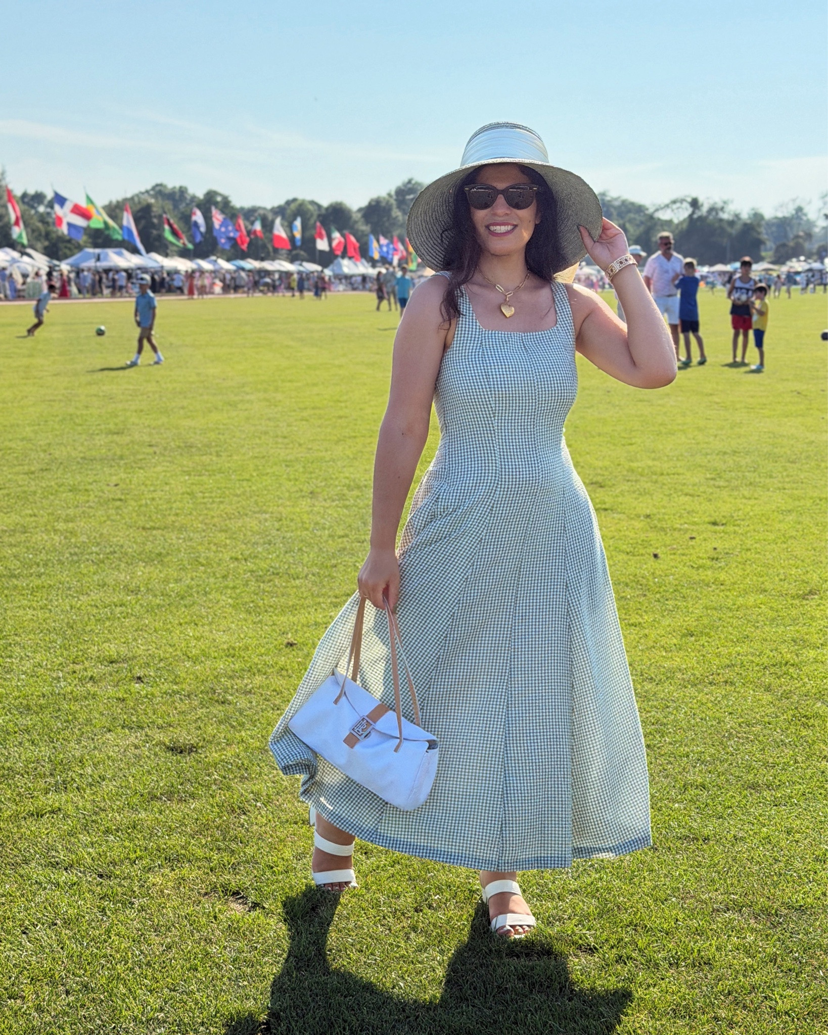 First time at a polo match for @annaavella_‘s bachelorette! If you can beat the heat, it’s such a fun time, lots of people go all out for the polo theme and tailgate all day. 

Gingham Dress @joie via @tjmaxx 
Hat @eugeniakimnyc via @thredup 
Bag @laurenralphlauren via @marijaneboutique 
Bracelet @talbotsofficial 
Sunglasses @rayban