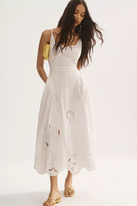 The perfect white dress for summer, with Lacey cut-out details, neckline and midi length 

#LTKwedding #LTKstyletip #LTKxAnthro