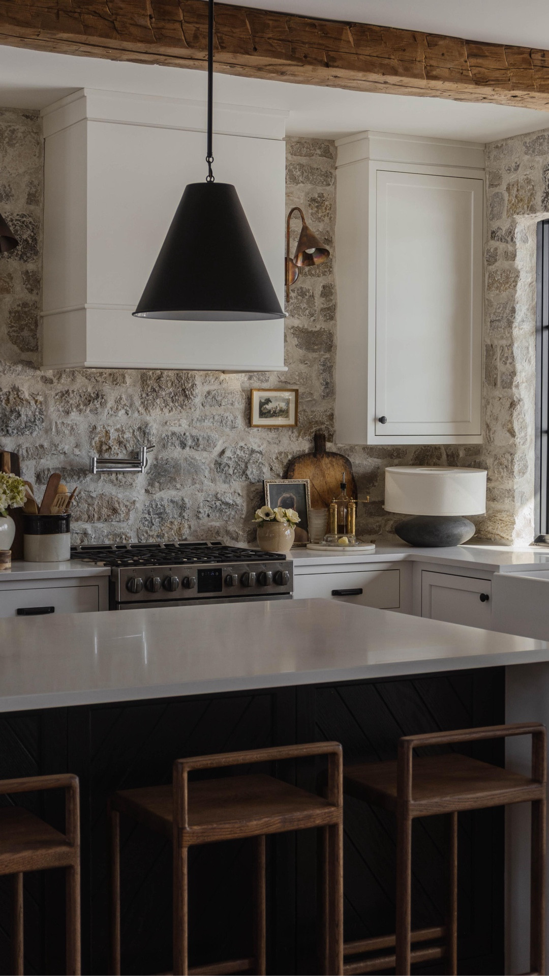 Kitchen finishes you always ask about 🤍
Reclaimed wood beams, natural stone, warm wood tones, soft neutral palette and timeless details. 

Natural stone details: Huron Gold Ashlar in Tumbled. Warm white mortar 


#kitchenhomefinds #neutralkitchen #kitchenmakeover #kitchenremodel #vintagehome #classichomedecor #homedecor #earthyinteriors #kitchenstyle #springdecor #naturalstone #kitchenchair #pendantlighting #lamp #moderrustichome 

#LTKSeasonal #LTKHome