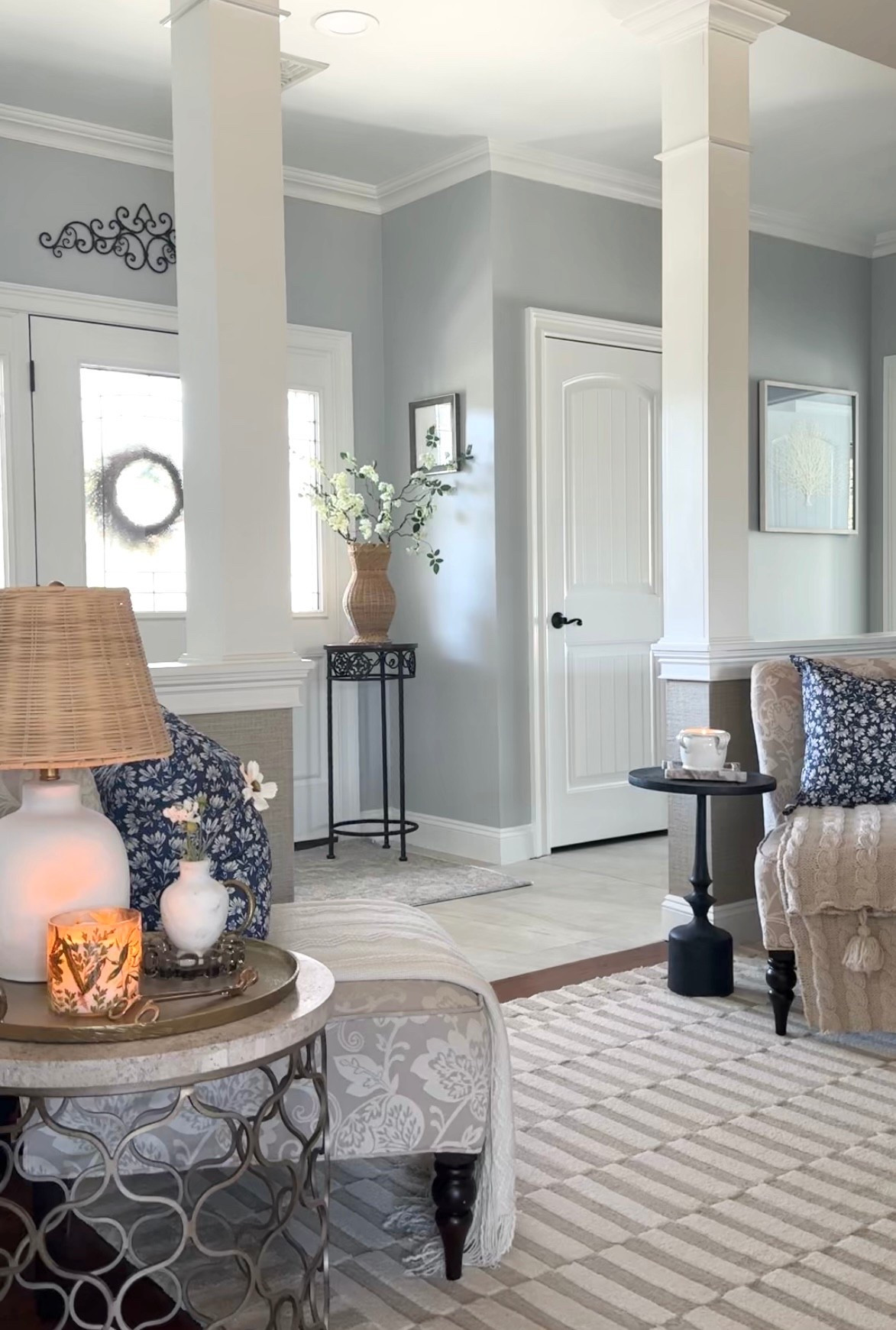 Entryway spring styling. Shop neutral rug, blue throw pillows, blankets, candles, rattan vase, florals and more! Amazon home, Target, Wayfair, Pottery Barn. 

#LTKSaleAlert #LTKHome