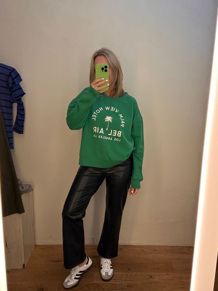 Cute green sweater from Anthropologie paired with white sneakers and faux leather spring at Patrick day outfit 

#LTKover40 #LTKparties #LTKSeasonal