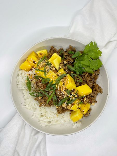 MANGO TERIYAKI TURKEY RICE BOWL. Anytime I ask my kids what they want to eat 8 out of 10 times they will say ground turkey and rice, which makes me happy because it’s something I can also eat everyday (plus it’s quick + easy to make). Great thing is the meat can be flavored and seasoned SO. MANY. WAYS. 👏🏼  

TO MAKE: Add olive oil to a large pan on medium to high heat. Add ground turkey, chop well and cook until lightly browned. Drain if necessary. Add teriyaki sauce, minced garlic, salt and cracked pepper. Gently mix. Cook until sauce is caramelized. Serve with jasmine rice. Top with mango chunks, sliced green onions, cilantro, crushed peanuts, sesame seeds and red pepper flakes (optional). 

Pans, white bowls, kitchen utensils 

#LTKfamily #LTKhome #LTKfindsunder50