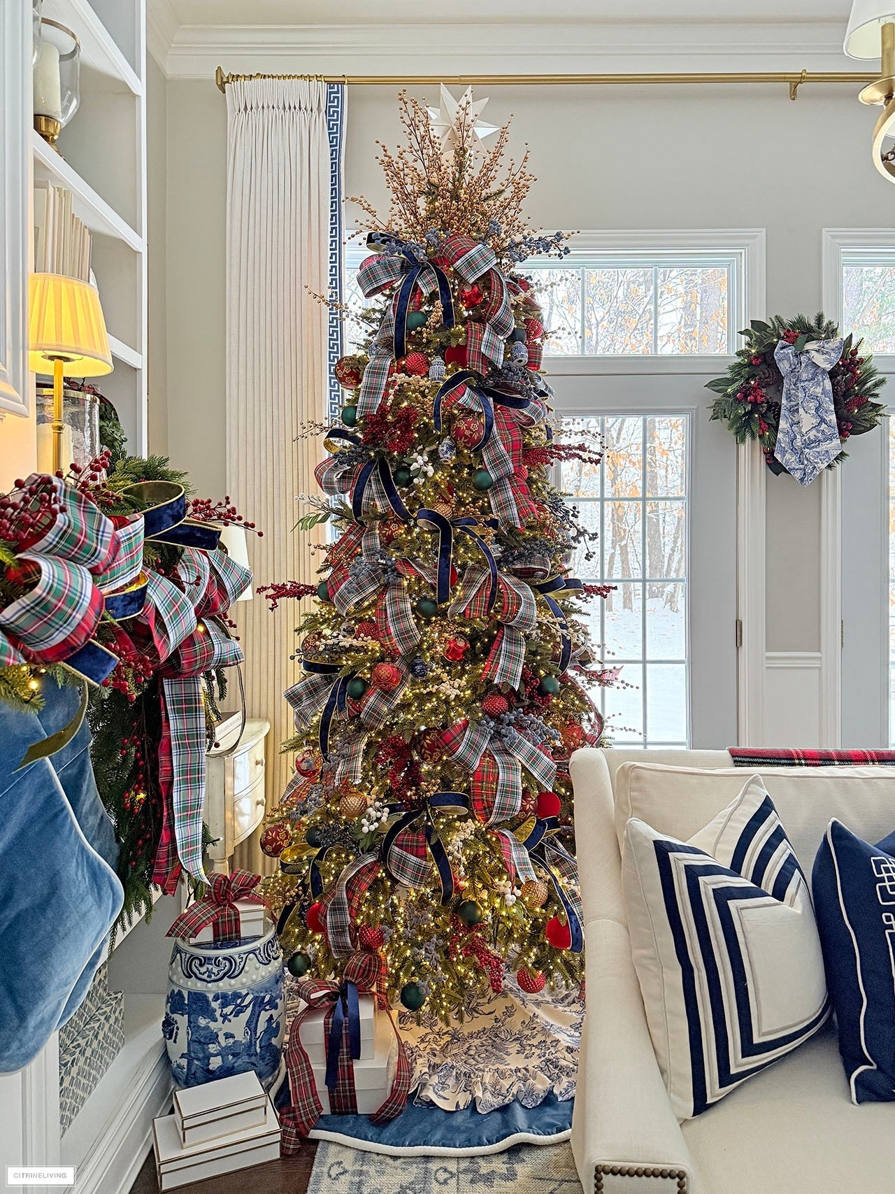 Our Christmas tree layered in gorgeous plaid and velvet ribbon, blue and white chinoiserie ornaments, red, gold and green! Ruffled toile tree skirt layered over our velvet tree skirt is a chic mix!

#LTKHome #LTKHoliday #LTKSeasonal