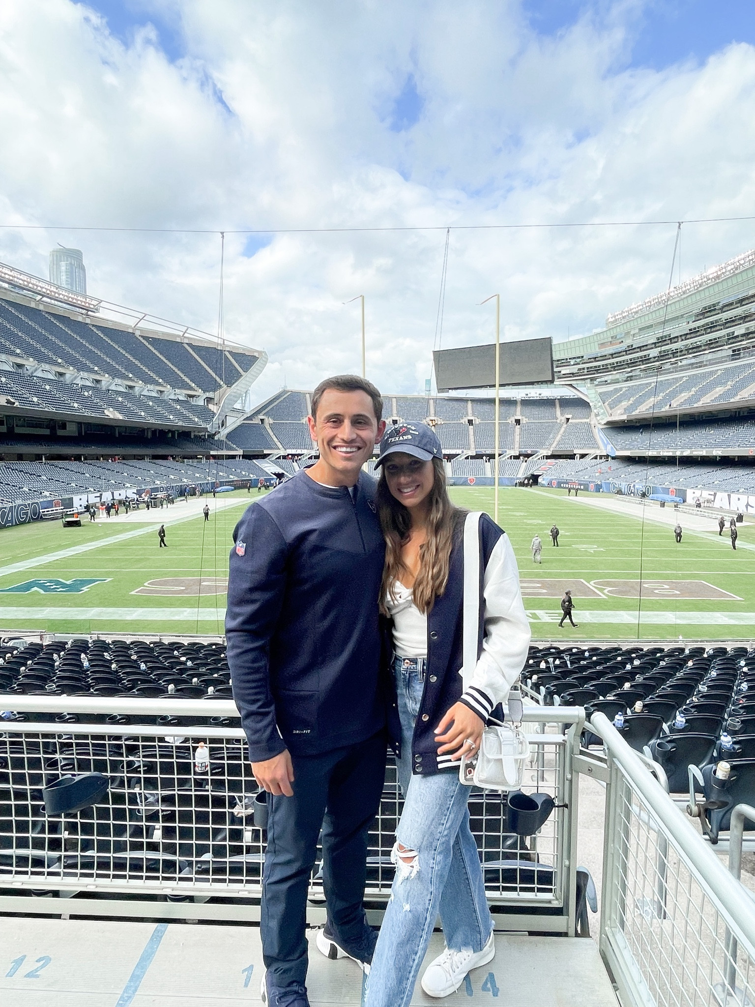 NFL game day outfit inspiration: navy varsity jacket with a strapless sweater top, ribbed denim, and my favorite clear stadium bag! 

#LTKunder50 #LTKstyletip