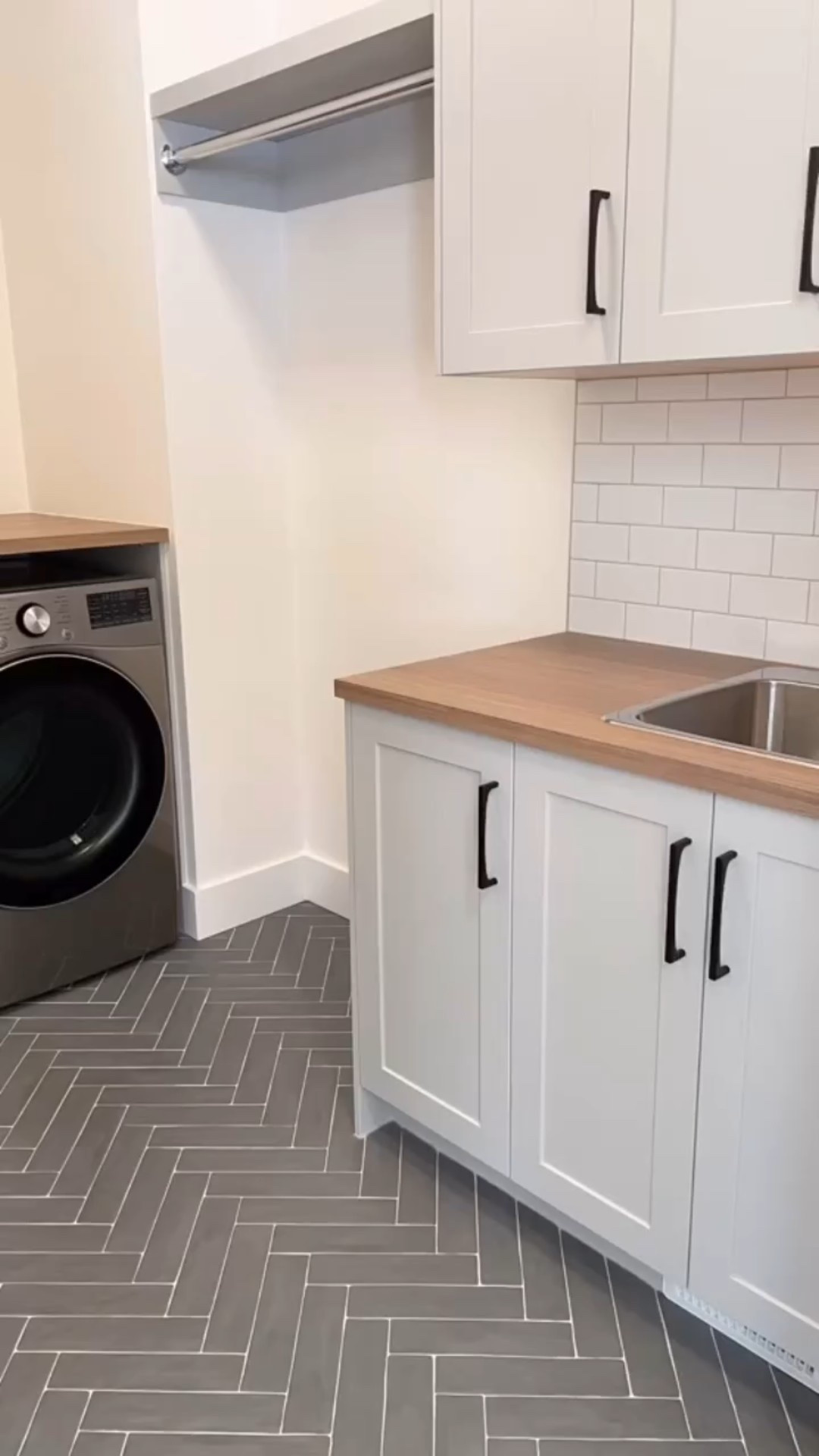 Laundry Room Details: From the hanging bar to the cabinets, herringbone tile floor and large sink with pulldown faucet, I’m not sure what I enjoy most. I definitely know I want to create a functional and beautiful laundry room in our next home too!

Tell me, do you have a fantastic laundry room? What do you love about it? What would you change?

#LTKHome