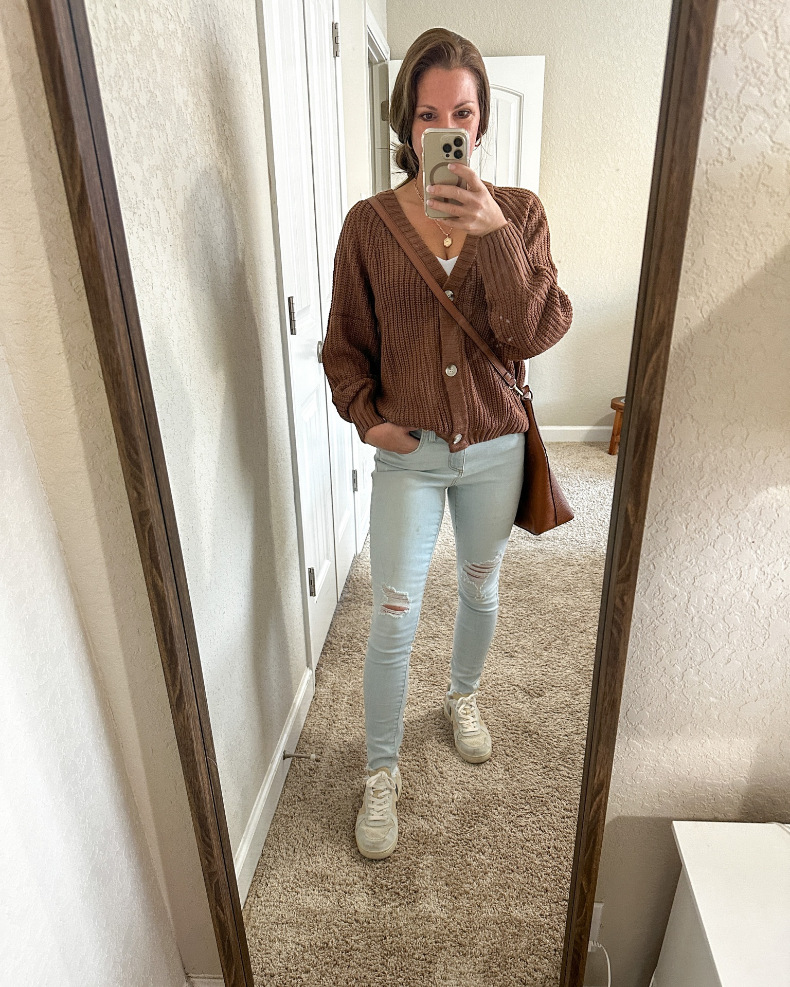 Fall look! This button up sweater is so versatile with jeans, black pants, or a mini skirt. And girl, is it cozy! 

Wearing size small top, size 25 light color jeans. Crossbody handbag- sneakers - high rise jeans - light wash blue jeans - sweater - top - white tank - casual fall outfit

#LTKSeasonal #LTKU #LTKfindsunder50
