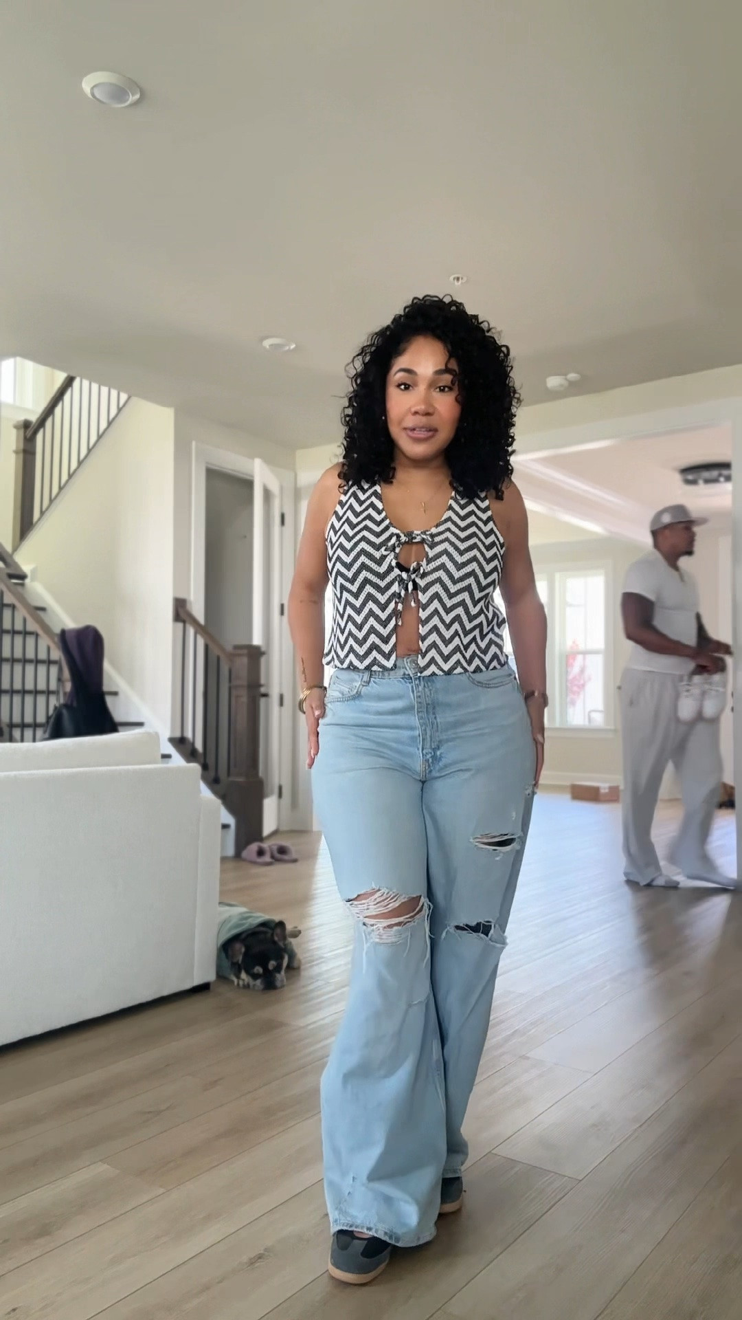 Mother’s Day outfit loading 💙 Finally feeling comfortable reaching for pieces that have been sitting in my closet waiting for their moment. Since starting my anti-inflammatory lifestyle, I’ve been slowly feeling less puffy and more like myself again, and this H&M tie-front top was one of those pieces I couldn’t wait to wear confidently. Paired it with my favorite Zara wide leg ripped jeans that literally stay on repeat, Adidas Samba Mary Janes, my Prada nylon bag, and Gucci sunglasses.

Also featuring Deuce in his Spark Paws hoodie and Spring Shorty making a last-minute outfit change from pink to blue for Mother’s Day because he knows pink is NOT my ministry 😂💙

Linked my favorite wide leg jeans, H&M outfit details, Samba Mary Janes, Prada bag dupes, and oversized casual outfit staples on LTK. @Zara @adidas 

#LTKStyle #MothersDayOutfit #WideLegJeans #ZaraJeans #HMStyle #SambaMaryJane #AdidasSambas #CasualChic #EverydayStyle #MomStyle #SpringOutfit #NeutralStyle #PradaNylonBag #FashionOver40 #CurvyStyle