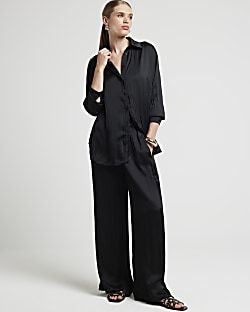 Black satin crinkle trousers | River Island (UK & IE)