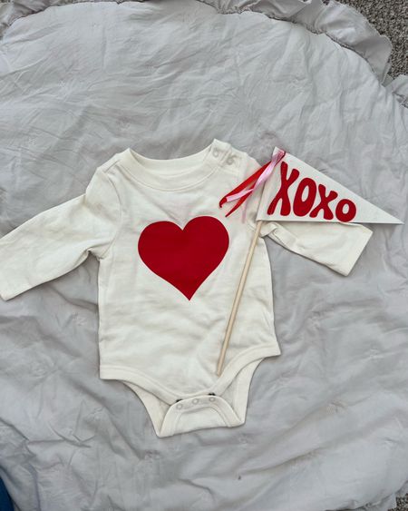 Valentine’s Day outfit baby. Baby photo shoot idea. February baby photos. Valentines baby onesie. Glad is from dollar section at target! 

#LTKbaby #LTKSeasonal
