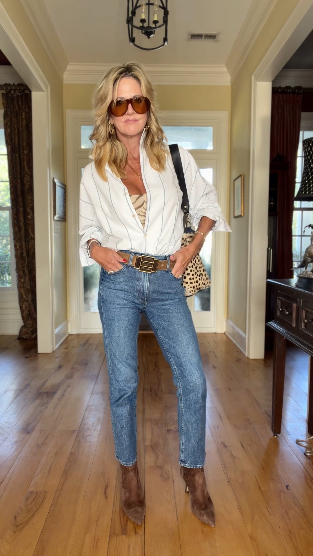 My top is available in solid white, black & blue. I love the collar on it. It’s oversized so you could definitely size down!
I’m in a 25 in the jeans—they are TTS.

#LTKgrwm #LTKfitnessgoals #LTKOver40