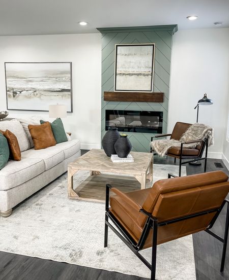 Styling a family room with a pop of color! We complemented the accent fireplace with neutral tone furniture and decor. 

#LTKhome #LTKfamily #LTKstyletip