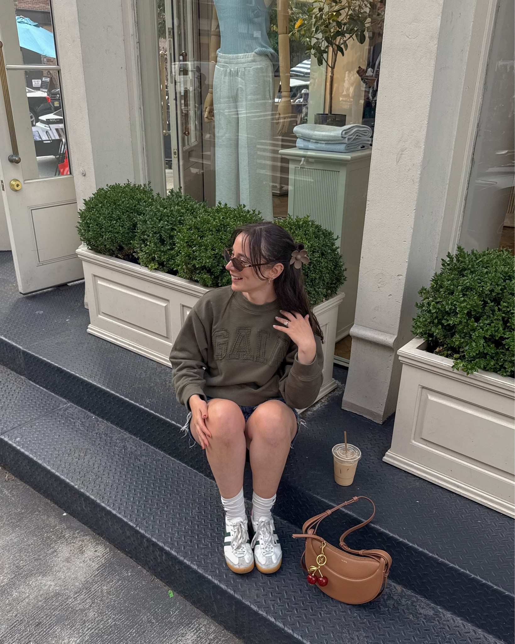 
transitional fall outfit inspo, fall fashion, fall outfit, fall outfits, fall 2025, fall dress, fall fashion, inspo, outfit ideas, outfit fall, preppy outfits, green sweatshirt, gap sweatshirt, denim shorts, fall shorts outfit, oval sunglasses, miu miu sunglasses,