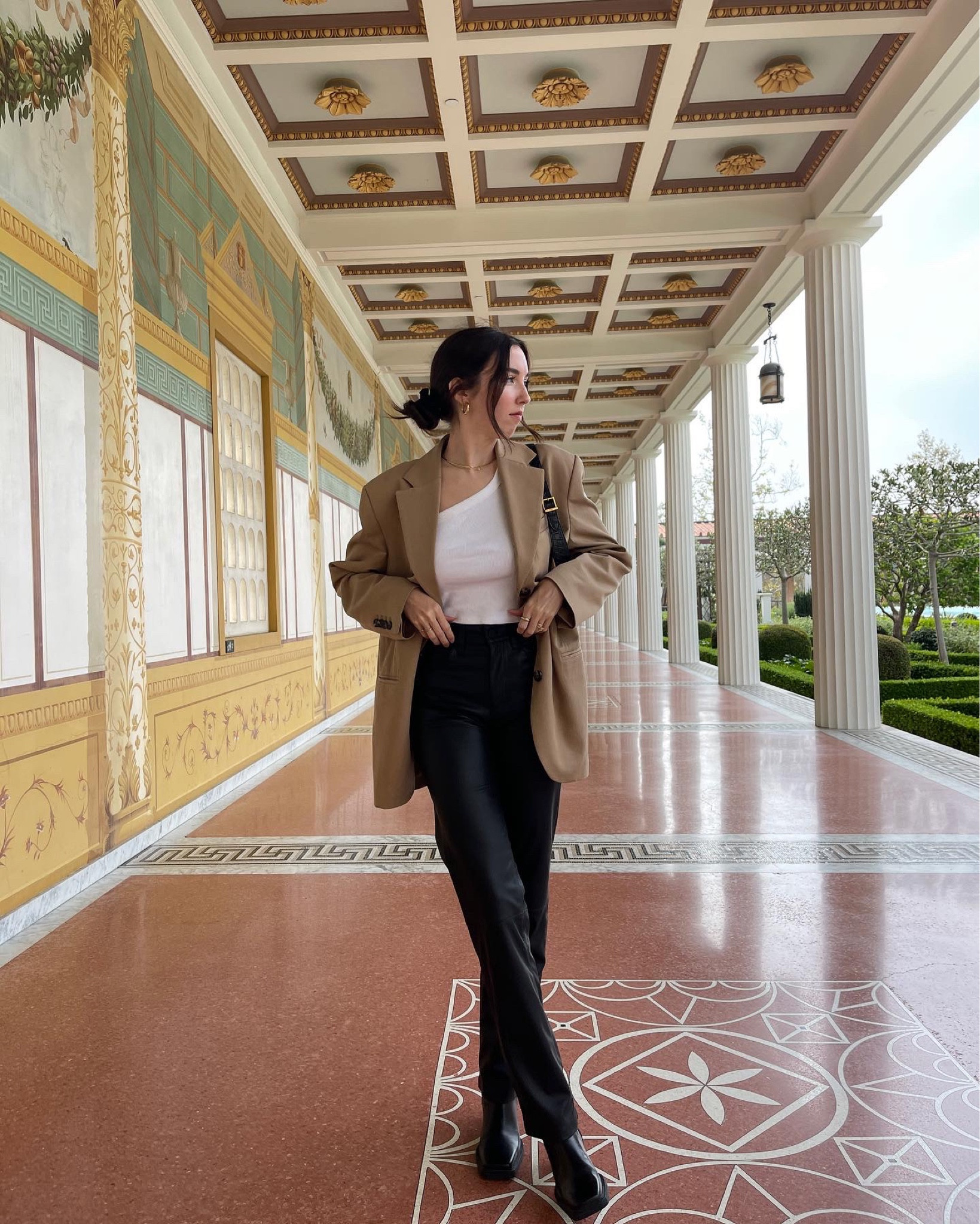 Easy fall outfit idea 🤎 pair an oversized blazer with a white tank, leather pants, black boots, and a black bag. Top it off with a low, messy bun and gold jewelry  

#LTKSeasonal #LTKitbag #LTKstyletip