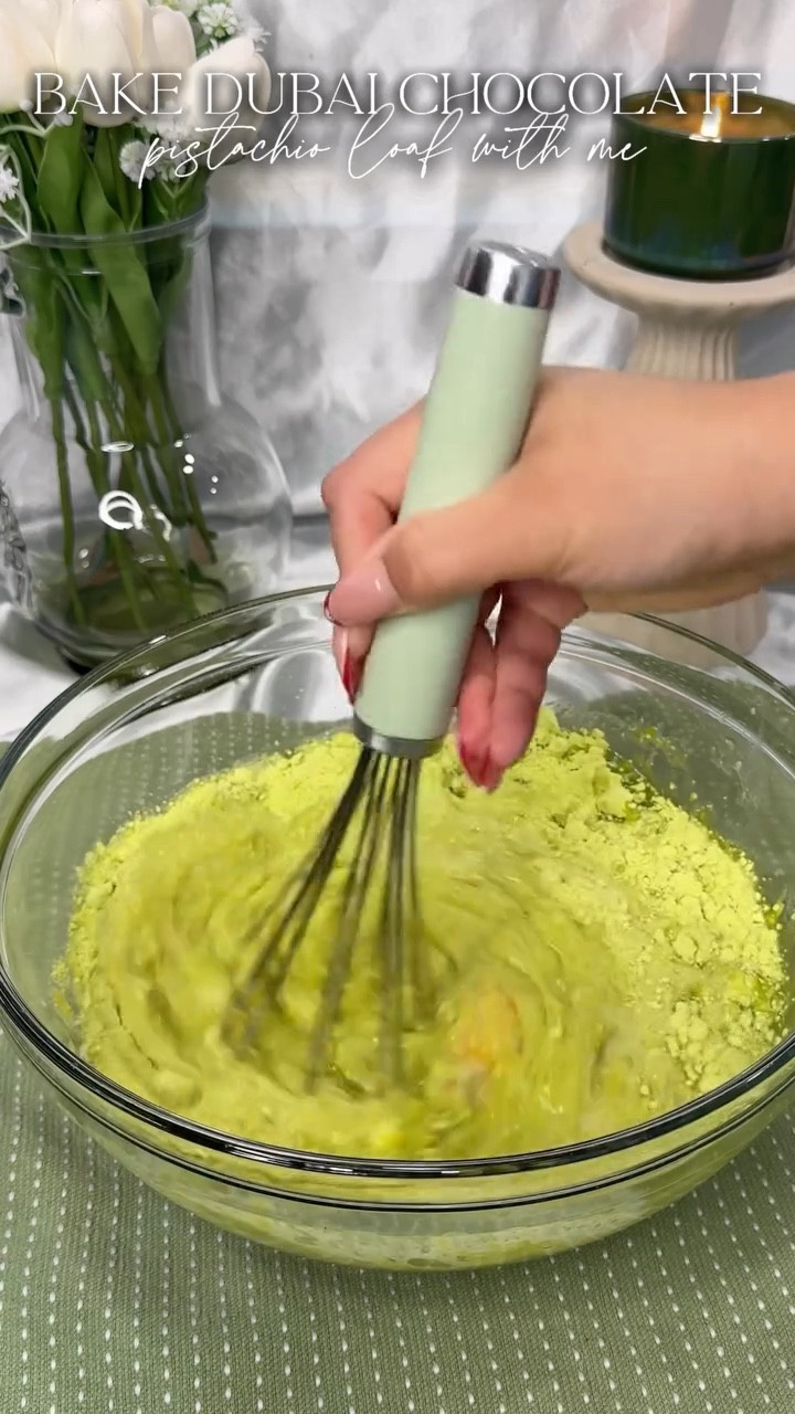 I tried Starbucks new chocolate pistachio loaf and it was just ehh okay.  I knew I could make a better version at home for the cost of the one loaf slice. That’s what I did, perfectly pistachio and moist topped with chocolate ganache icing and crushed pistachios. It definitely has a slightly artificial pistachio taste but we took the easy way out by doctoring a box cake mix and pudding mix, but there is oddly comfort in those flavors. 
.
Recipe at the end for you to screenshot! 
.
#dubaichocolate #pistachiochocolate #sweetloaf #dubaichocolatebar #bakingrecipe