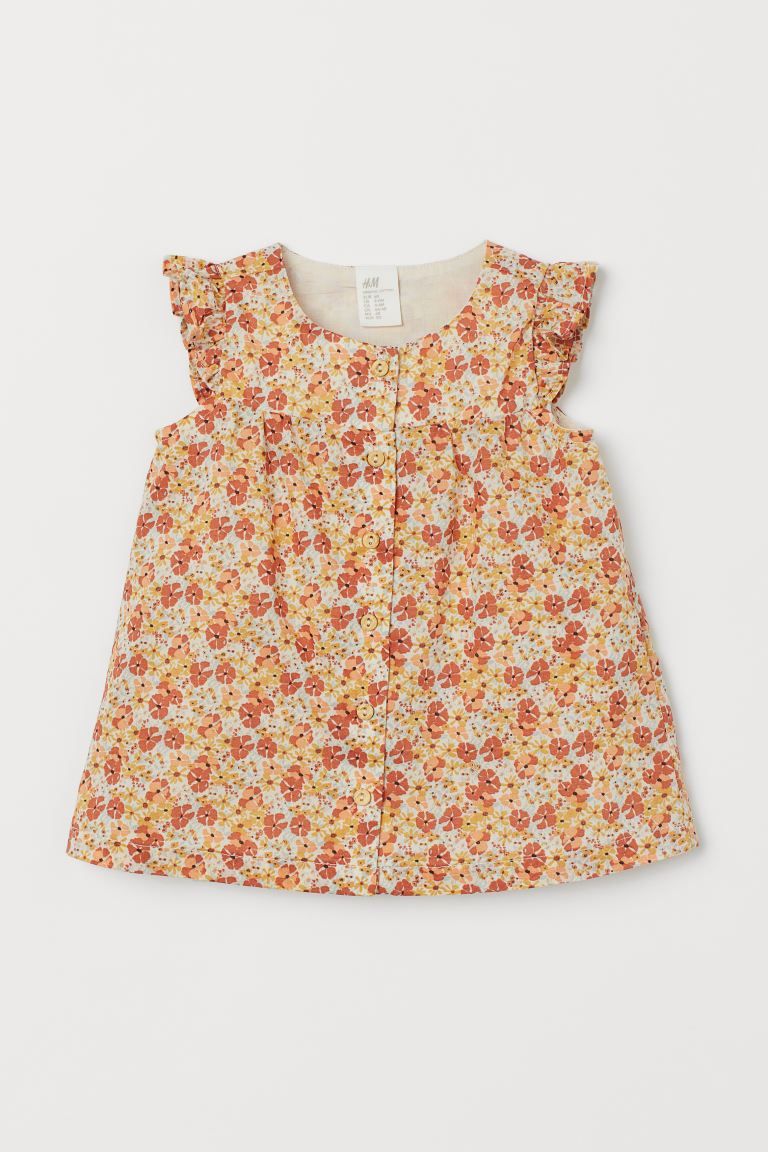 BABY EXCLUSIVE. Sleeveless dress in woven organic cotton fabric with buttons at front, lined top,... | H&M (US + CA)