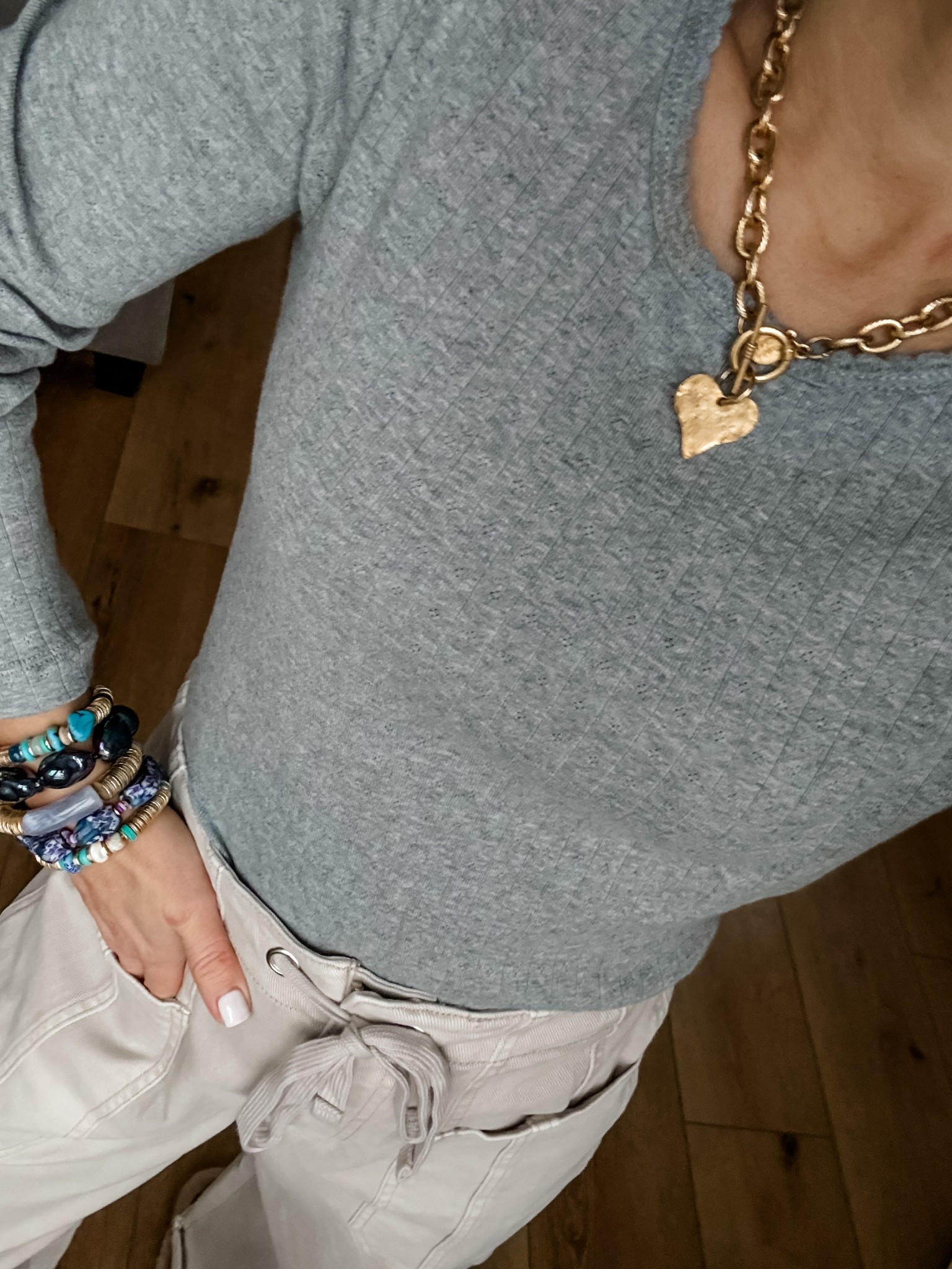 Small grey top, heart necklace. Bracelets code HOUSEOFLEO25

#LTKOver40