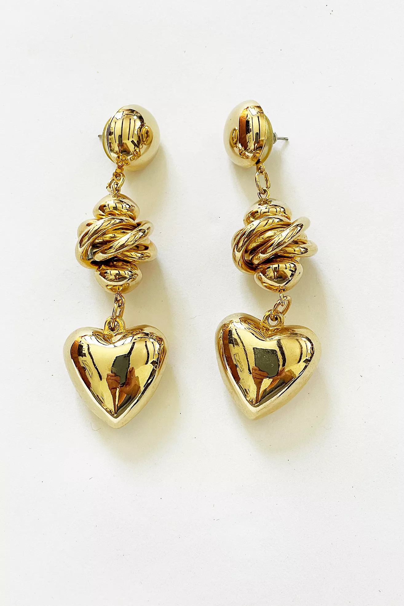 Vintage Gold Knot and Puffy Heart Drop Earrings Selected by FernMercantile | Free People (Global - UK&FR Excluded)
