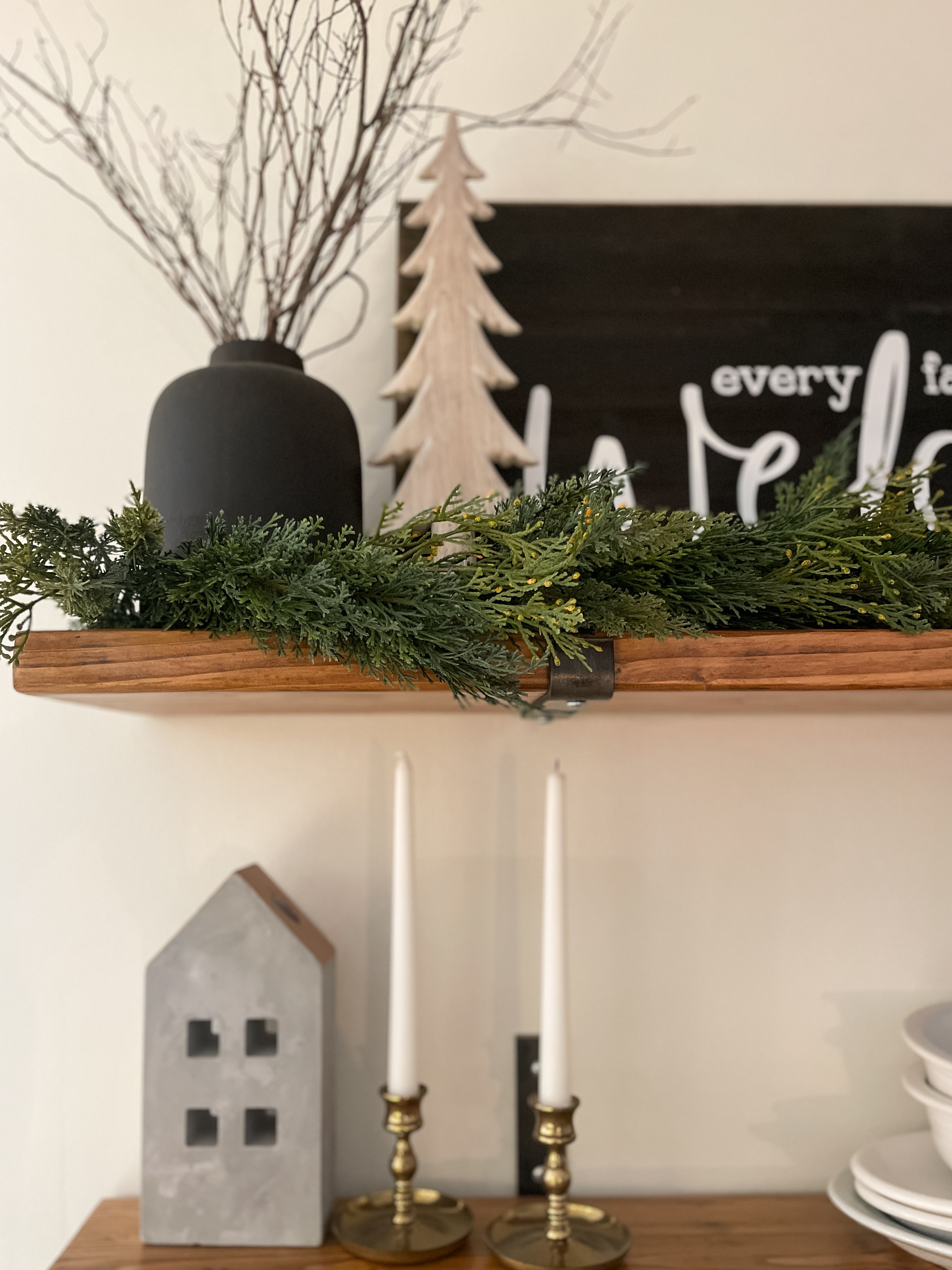 Winter decor and shelf styling includes garland, black vases and snow covered trees.  

Neutral home decor.  Winter home decor.  

#LTKHome #LTKSeasonal #LTKHoliday