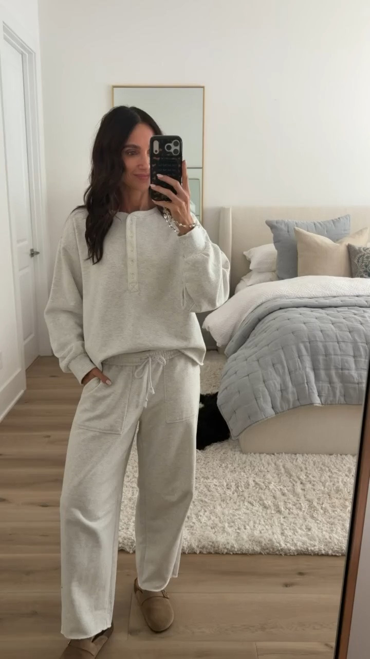 This cozy matching set is exactly what I want to wear on a slow morning or travel day. 🤍 I love the relaxed henley sweatshirt with the drawstring wide leg pants and oversized pockets. So comfortable but still cute enough to wear out!
matching sweatset, cream lounge set, henley sweatshirt, wide leg sweatpants, cozy matching set, neutral loungewear, travel outfit, airport outfit, casual fall outfit, comfortable matching set, fall loungewear, annabrstyle