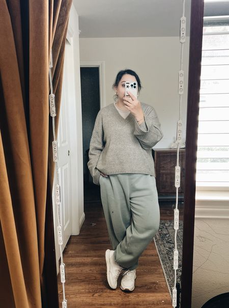 Sweater: TTS and perfectly oversized as is! I’m 38C and wearing a large.
Sweatpants: Super comfortable and TTS! I’m 5’2” and wearing a large.
Sneakers: Mjne are Zara. Runs TTS. I’m wearing size 7.5/38.
-
OOTD - comfortable lounge pants - wfh outfit - cozy fall outfit - errand outfit - green essential Sunday sweatpants Abercrombie - H&M lightweight green sweater - H&M cropped tank top beige - white leather platform sneakers - weekend look - fall outfit 

#LTKmidsize #LTKover40 #LTKstyletip