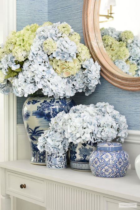 Gorgeous faux hydrangeas styled in a huge, lush arrangement is so chic!
Summer home decor, spring home decor, blue and white chinoiserie 

#LTKhome #LTKstyletip
