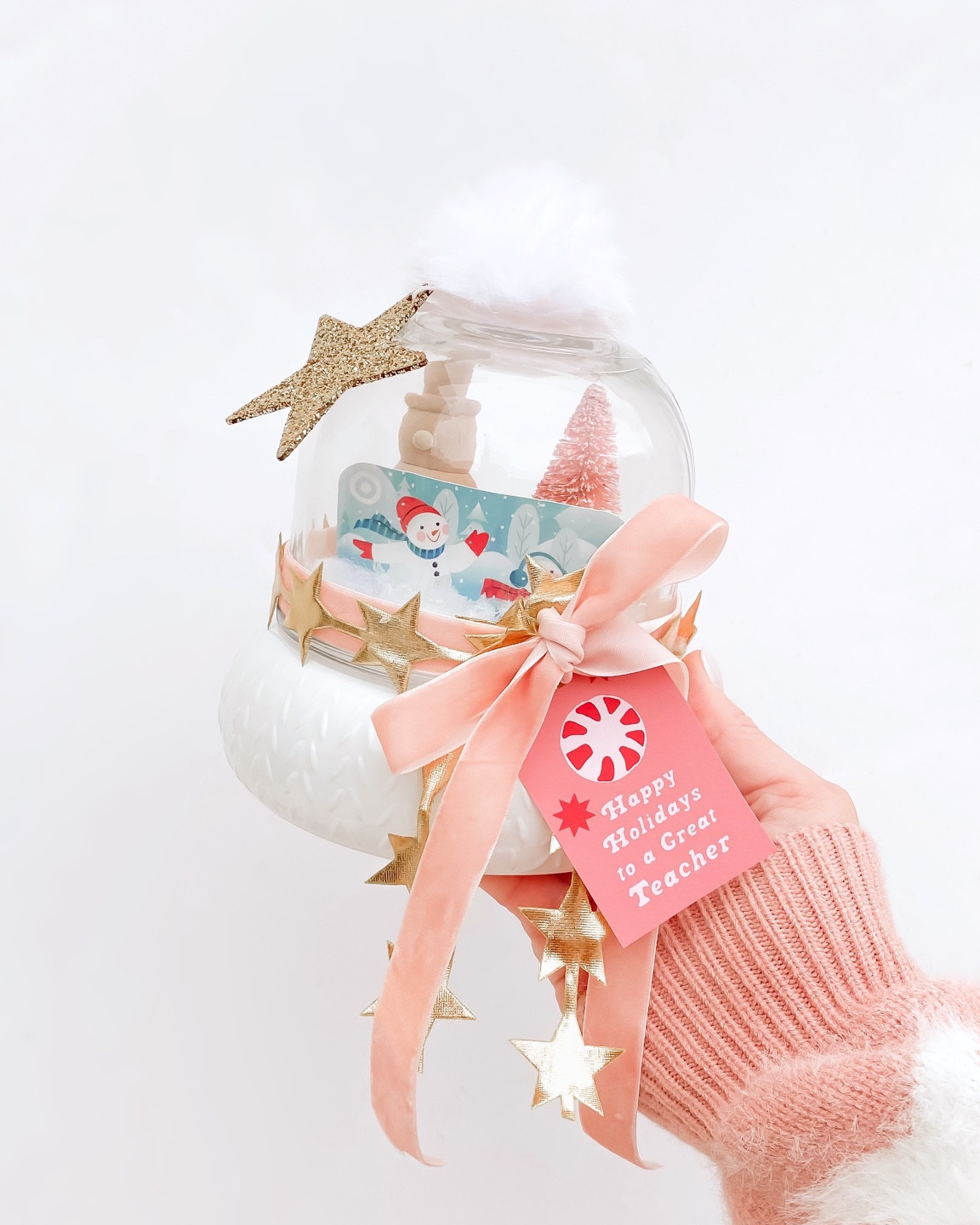 Teacher Christmas Gift 

Teachers want gift cards to Target & Amazon based on my polls on my social media.  Give a gift card in this adorable $5 @target dollar spot pom topped winter hat.  Fill with “snow”, bottle brush trees & wooden figures also from Target.  Add ribbon and a gift tag.  

#target #targetstyle #teachergift 

#LTKGiftGuide #LTKSeasonal #LTKHoliday