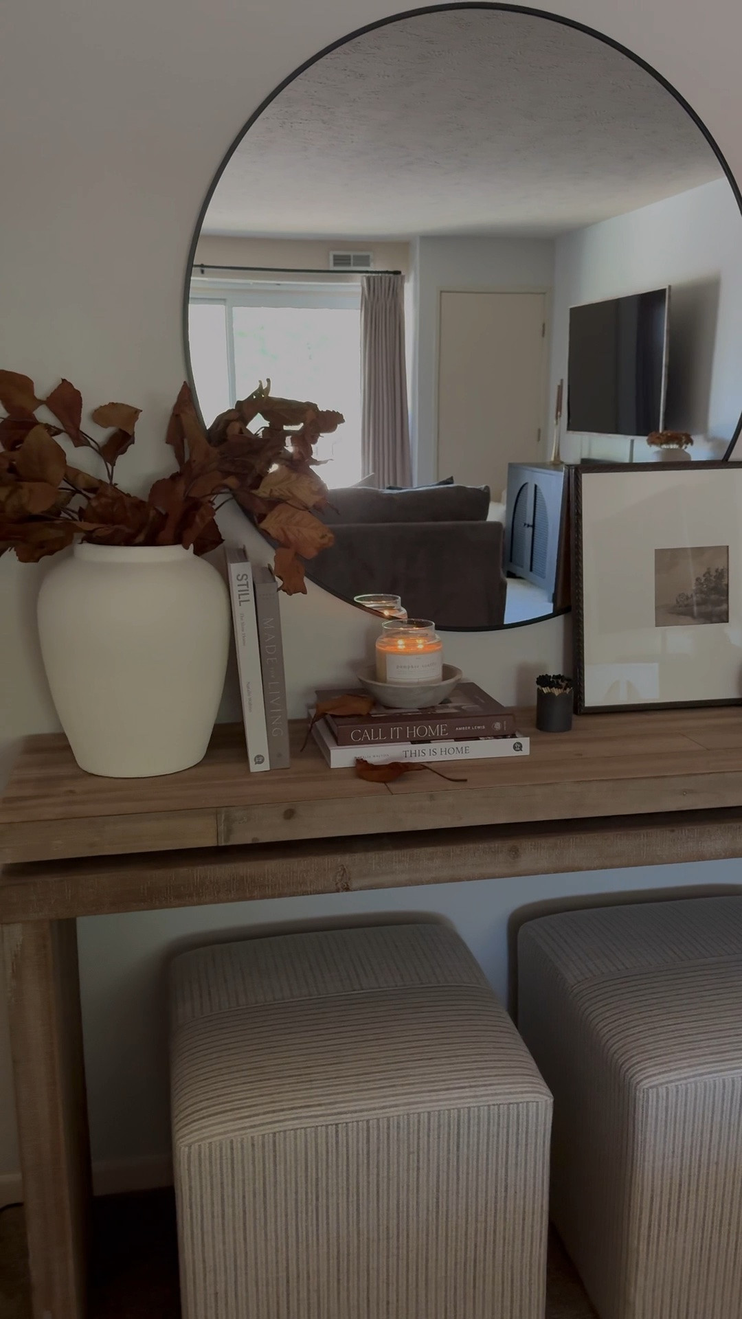 Fall console styling, fall decor, fall stems, leaf stems, white vase, wood console, ottoman’s, round mirror, candle bowl, candlesticks, coffee table books

#LTKSeasonal #LTKSaleAlert #LTKHome