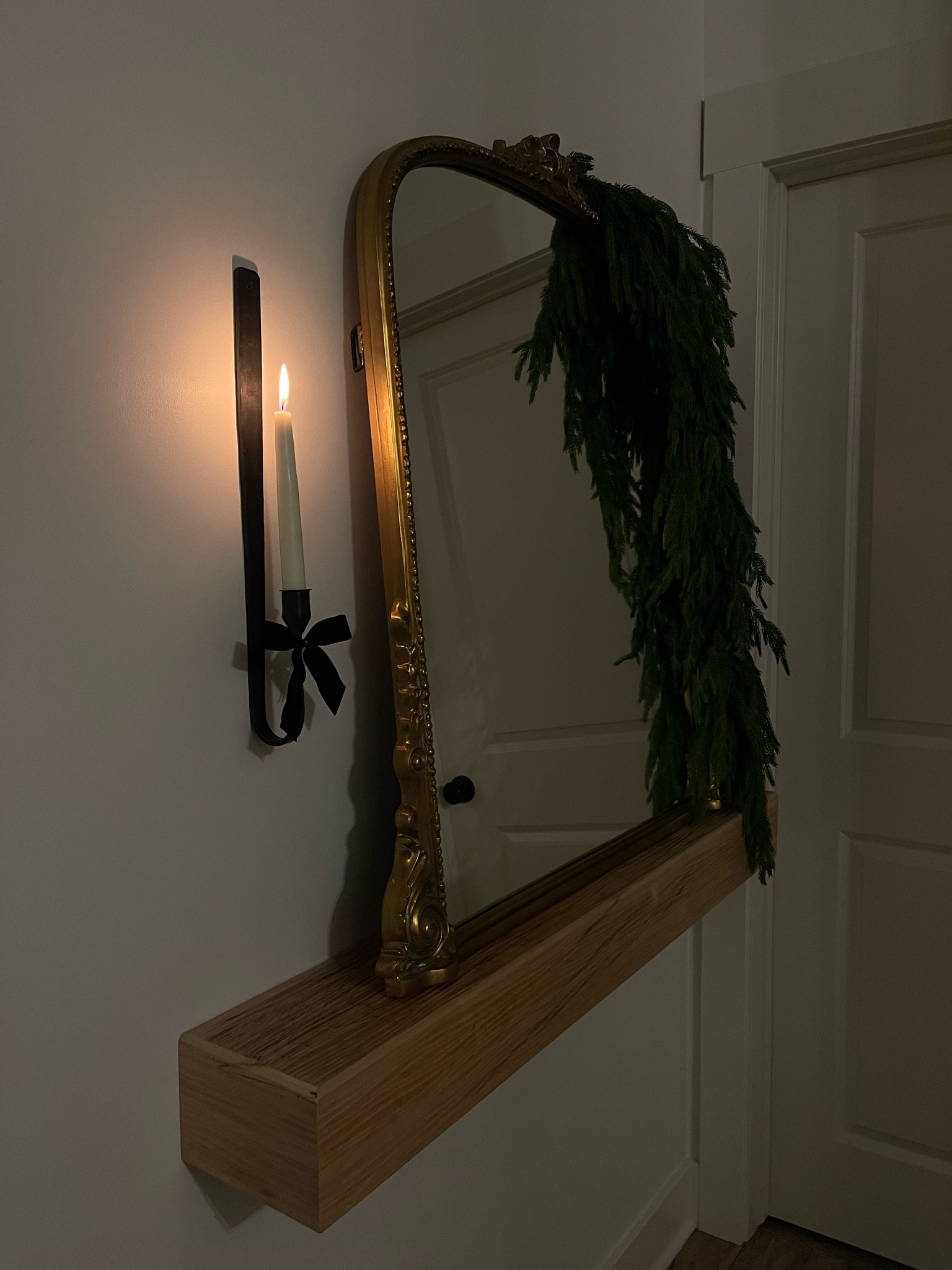 Cozy nights with our new wall sconce + primrose gold mirror and faux norfolk pine greenery from afloral. 

#LTKStyleTip #LTKSeasonal #LTKHome