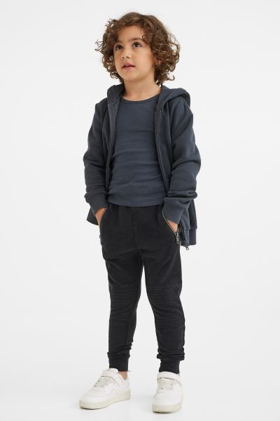 New ArrivalJoggers in washed sweatshirt fabric. Elasticized waistband with drawstring, side pocke... | H&M (US + CA)