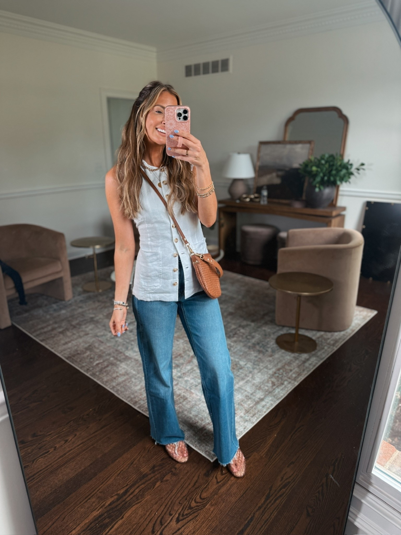 I love the touch of timeless style this button down vest gives. It’s just a classic linen staple with functional buttons and a tie that I tied in the back. Wearing it with these flattering jeans and my go to mom bag when I want an elevated look but need to fit all the stuff in my bag! 🩵

#LTKgrwm #LTKootd #LTKmomlife