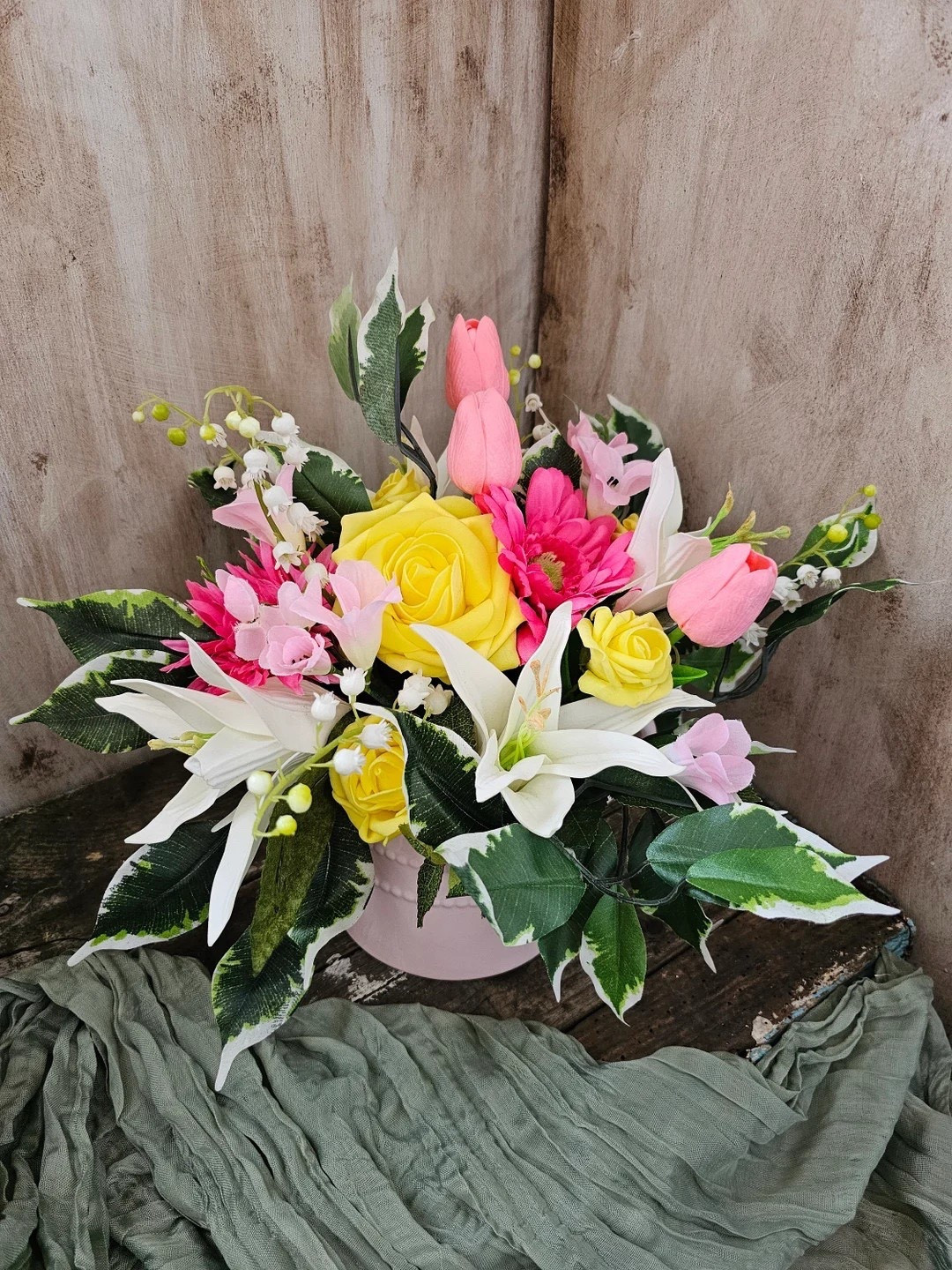 Sweet, timeless, and effortlessly charming — this floral arrangement by BlossomBeGifts is the perfect pop of pretty for any space. Set in a light pink ceramic watering-can planter, it features lifelike silk and foam flowers including roses, lilies, and real-touch tulips for a fresh-from-the-garden look. The soft pastel tones and elegant design make it a beautiful Mother’s Day gift, table centerpiece, or everyday home accent. Best of all, these everlasting blooms stay vibrant with zero maintenance. 🌸💗

#LTKhome #LTKdecor #FloralDecor #MothersDayGift #GiftIdeas #SpringDecor #HomeStyling #ArtificialFlowers #BlossomBeGifts

#LTKHome #LTKSeasonal #LTKFindsUnder50