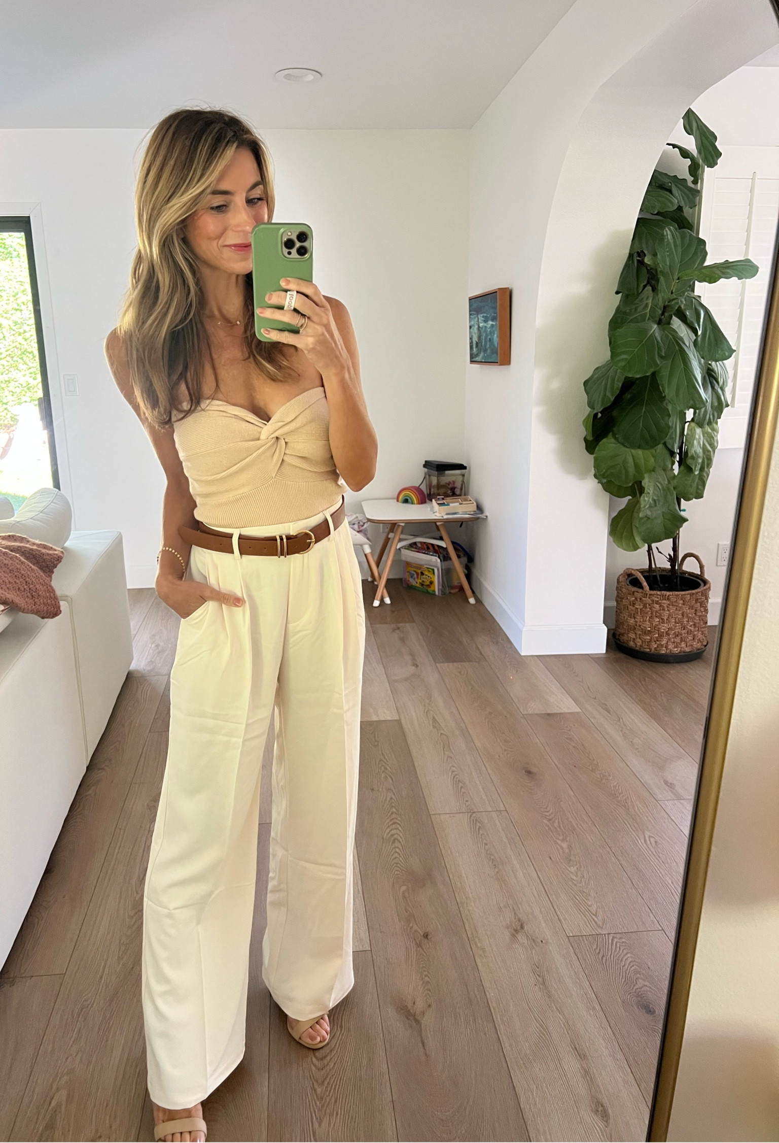 Feeling classy! These trousers are so cozy, they have an elastic back, & i got the “Long” ones that could drape over heels. Love this little tube too too. Kinda a gamble with a toddler though! 🤣 i got a few colors! I did a size Slong in the trousers & a Small in the tube top. The pants are a little baggy in the waistline, but the belt helps 😉 usually i go size XS, but glad i sized up on both of these. Belt came in a set with a black belt too!! 

The quality of these trousers is great, especially for the price, but you’ll definitely feel the difference between these trousers and Abercrombie trousers if you want to spend more! 

Cream trousers, beige trousers, wide leg dress pants, tube top, cream, belts, brown belt, nude block heels 

#LTKworkwear #LTKSeasonal #LTKstyletip